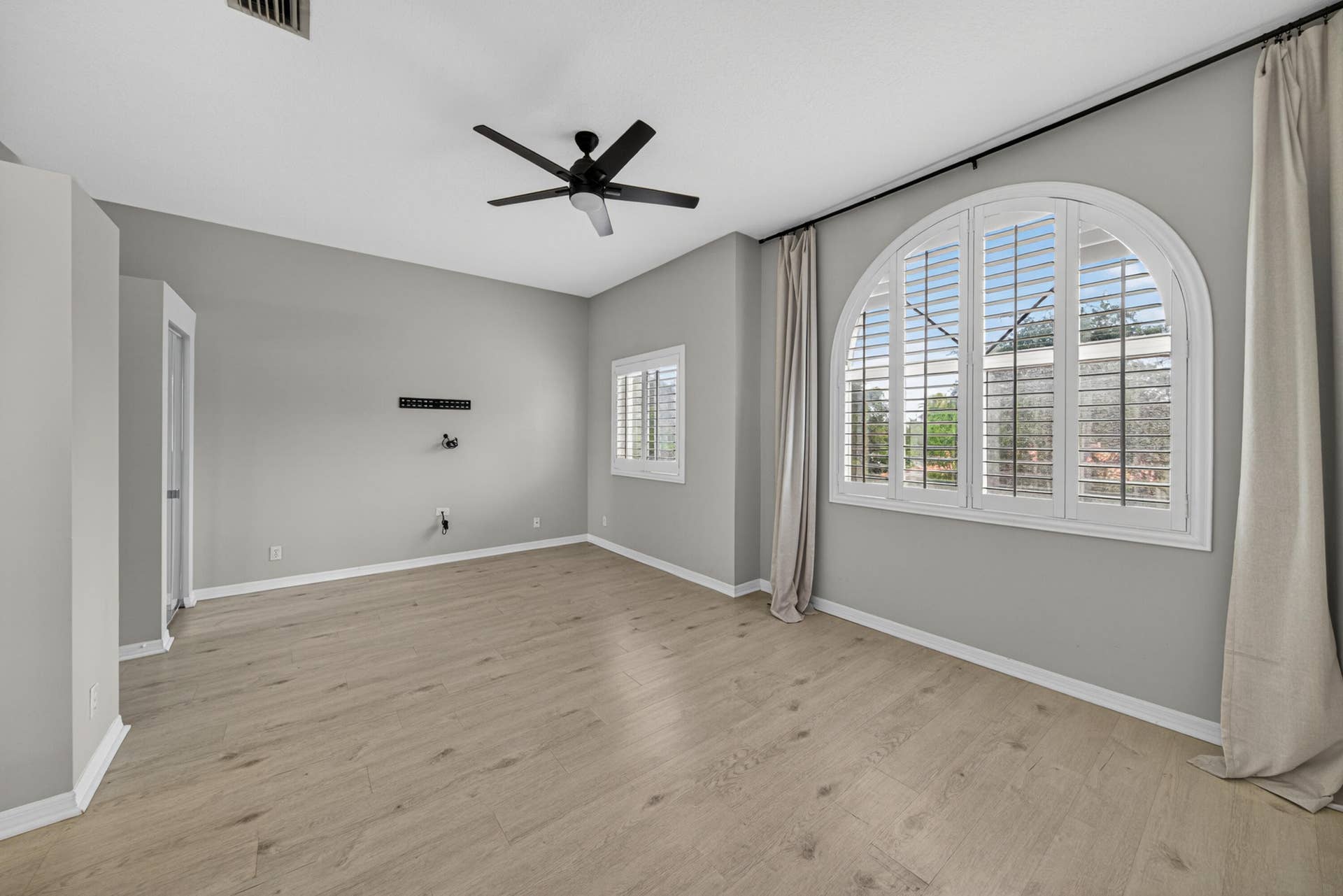 835 NE 17th Way, Fort Lauderdale, FL 33304 Plantation shutters in primary bedroom