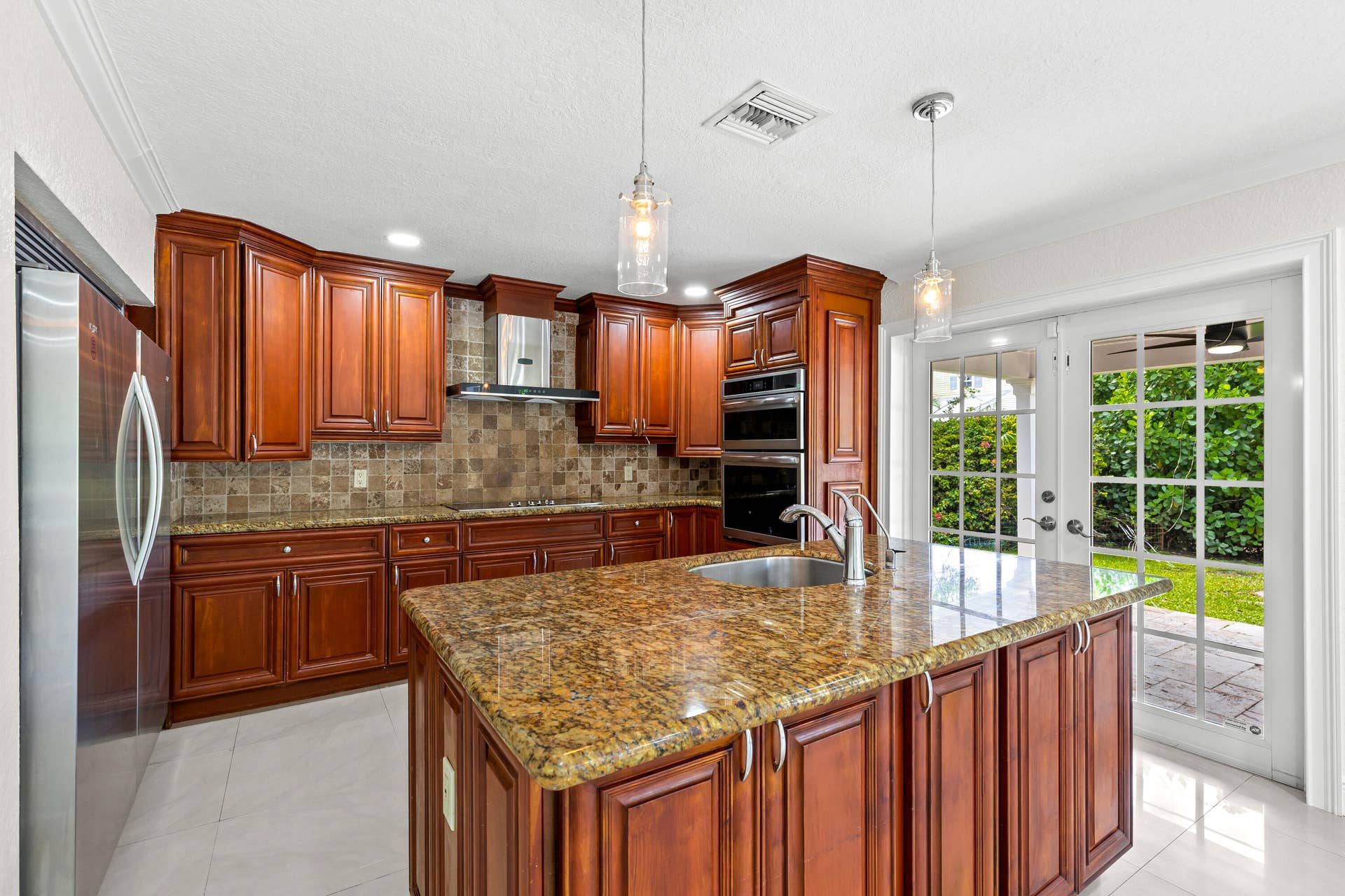 4610 Pinetree Drive, Delray Beach, FL 33445 french door access to Lanai