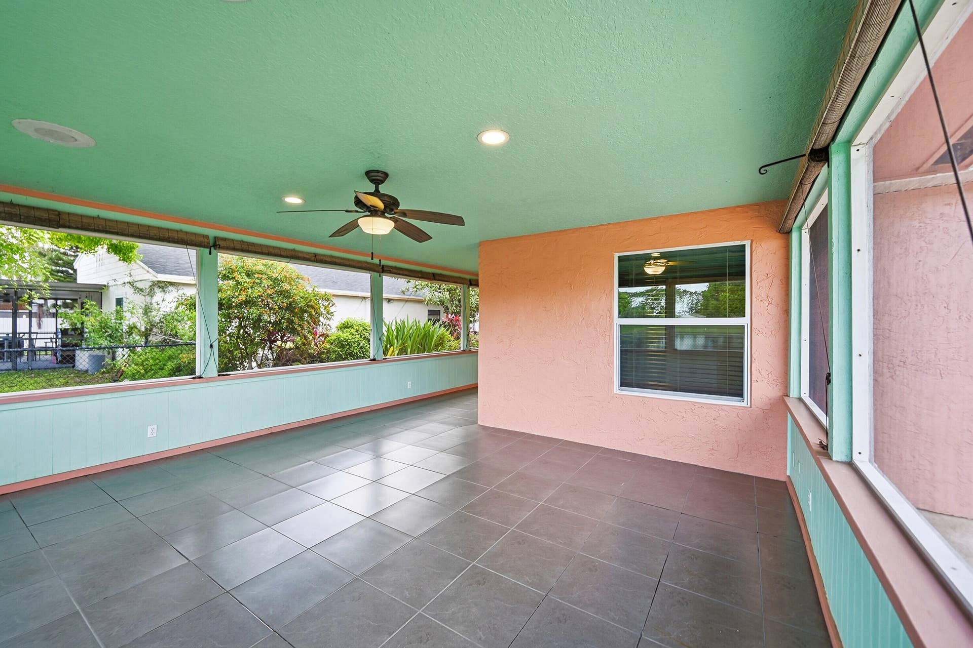 Artfully Landscaped fenced yard is a wonderful backdrop for this Lakefront Property.