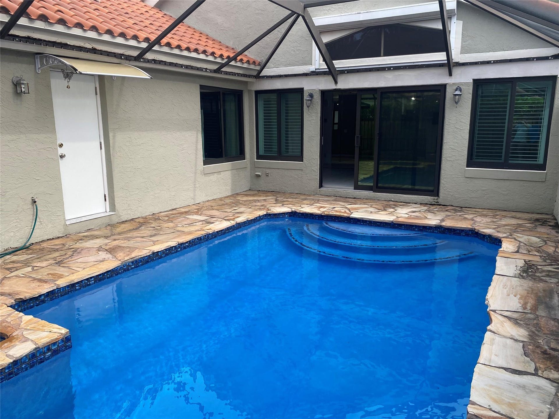 9760 NW 18th Drive, Plantation, FL 33322 screened pool/patio