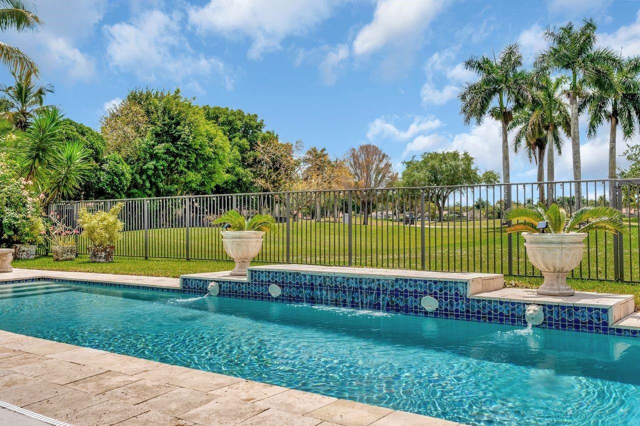 2491 Eagle Run Drive, Weston, FL 33327 Breathtaking golf views with meandering lake beyond!