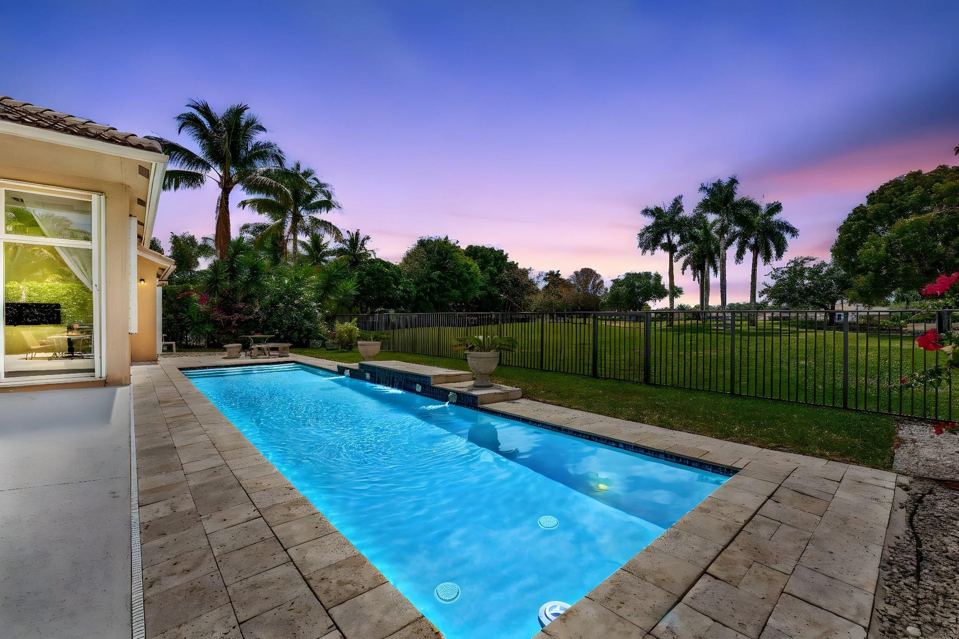 2491 Eagle Run Drive, Weston, FL 33327 Fabulous lap pool sparkles, by day or night!