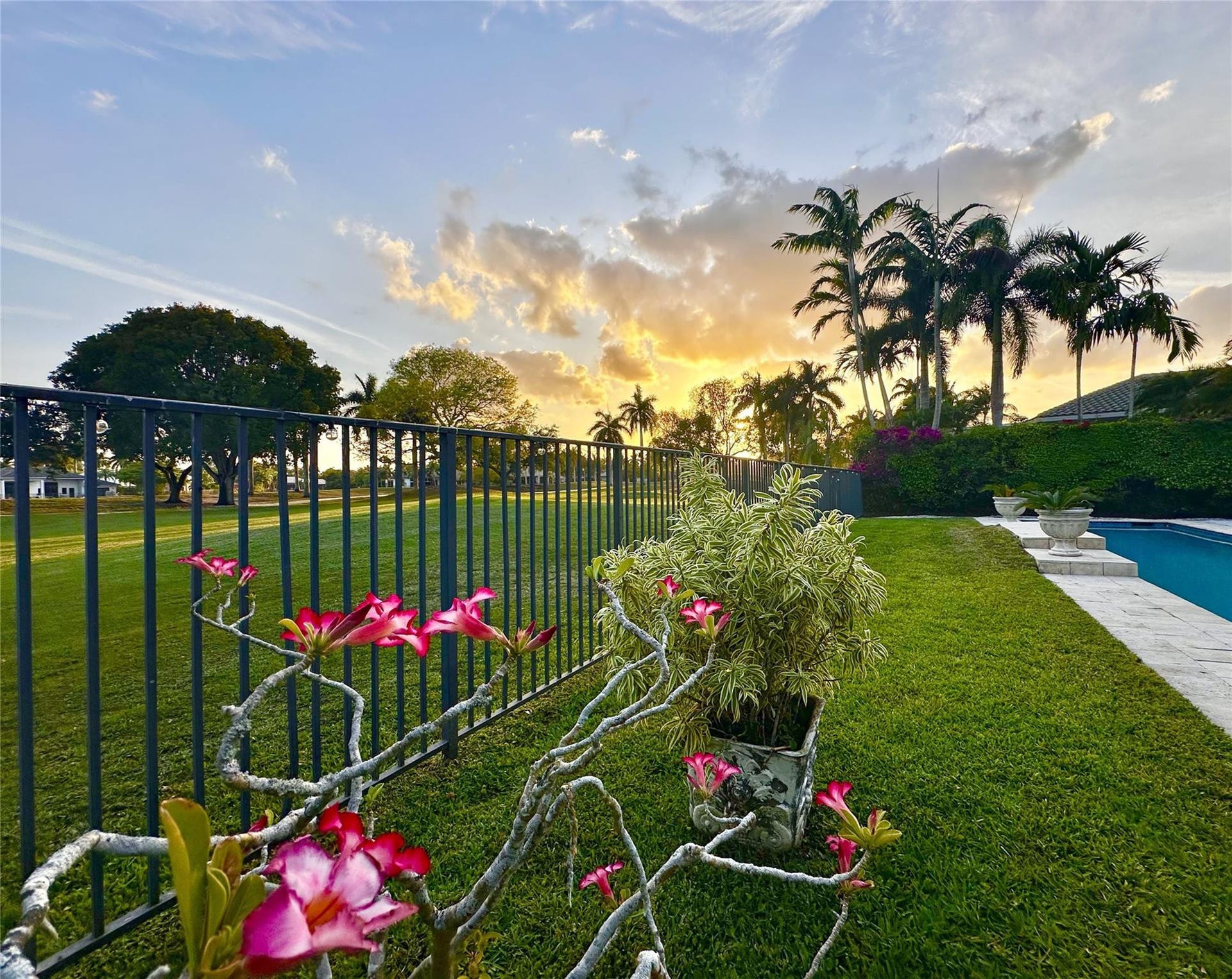 2491 Eagle Run Drive, Weston, FL 33327 Fully fenced backyard retreat with golf, pool and spectacular sunsets!