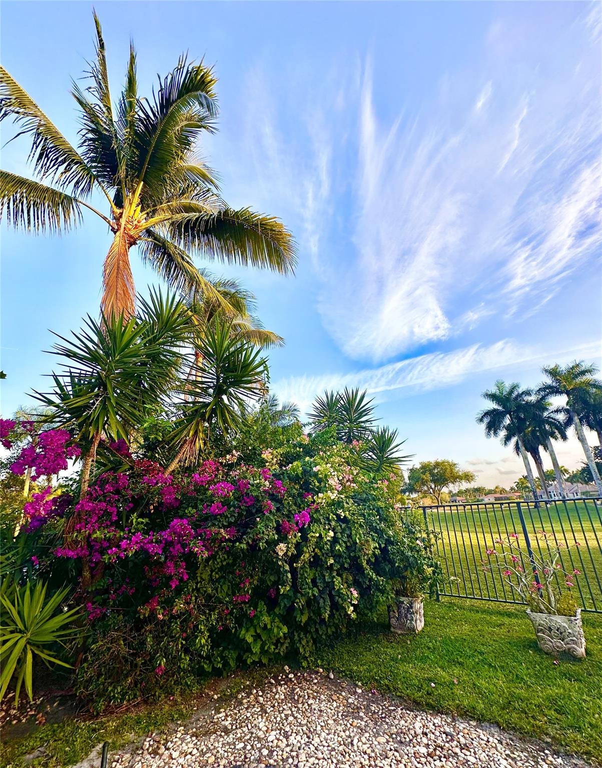 2491 Eagle Run Drive, Weston, FL 33327 Cascading bougainvillea and balmy palms frame this gorgeous backyard retreat!
