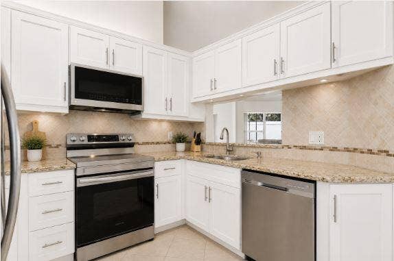 Kitchen - with cabinets virtually painted white and new hardware