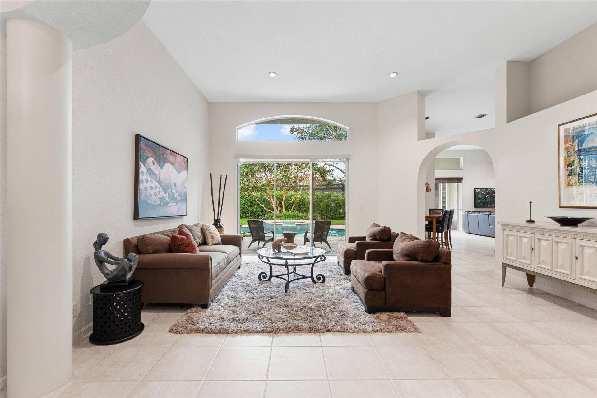 Living room with views of greenery outside