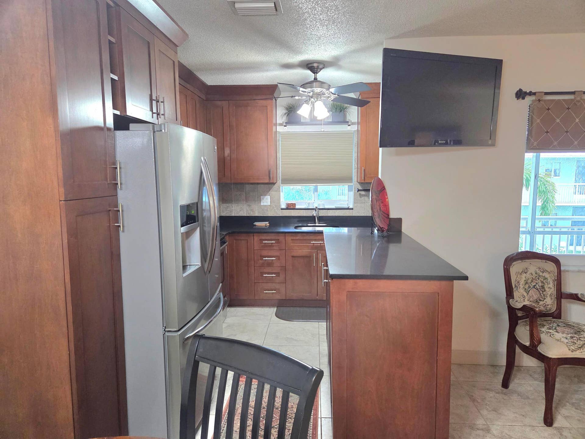 2100 NE 38th Street NE, #207, Lighthouse Point, FL 33064 Open kitchen with breakfast bar