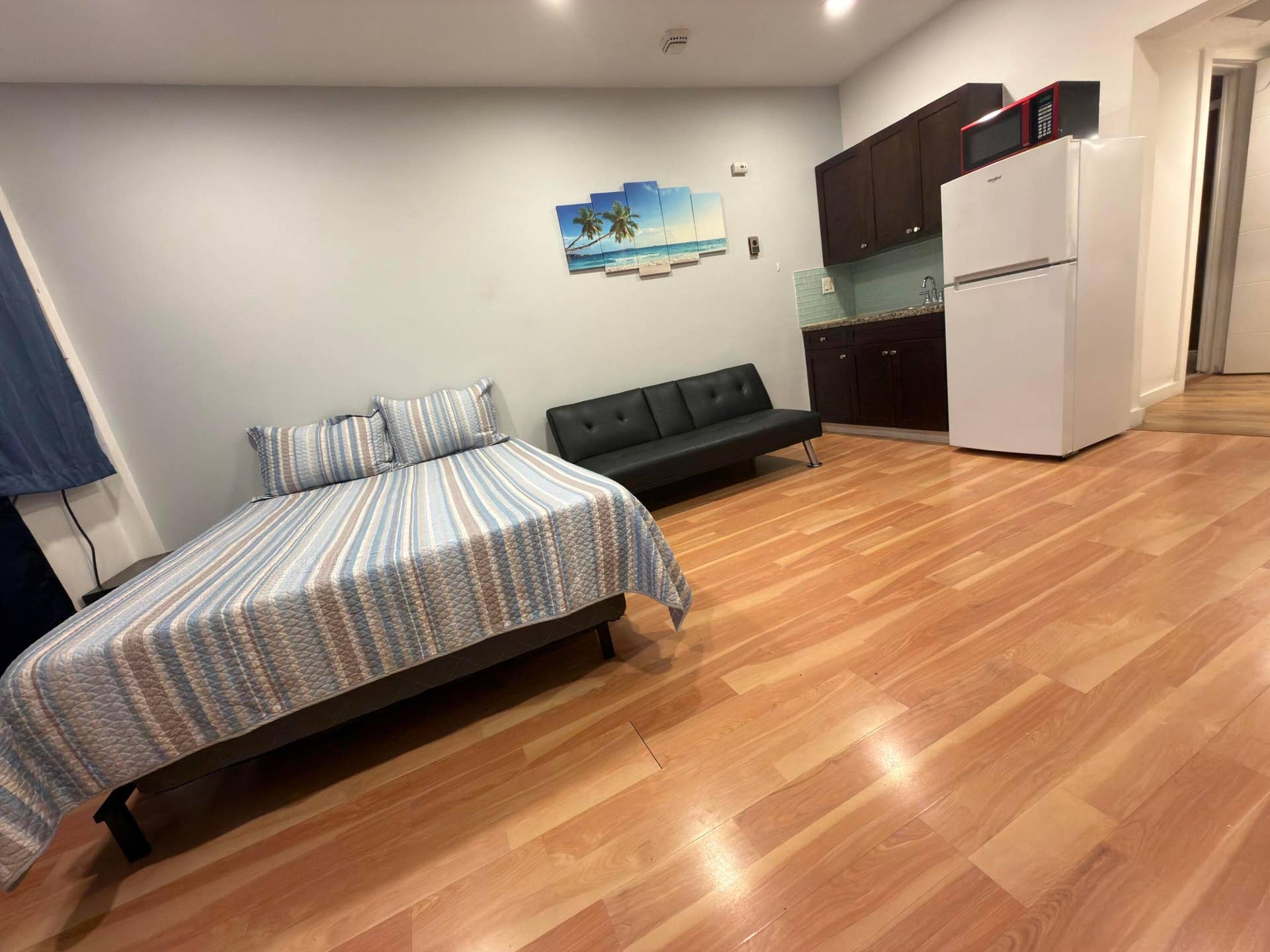 Queen size bed, fulton sofa and ktchenette with full size refrigerator.