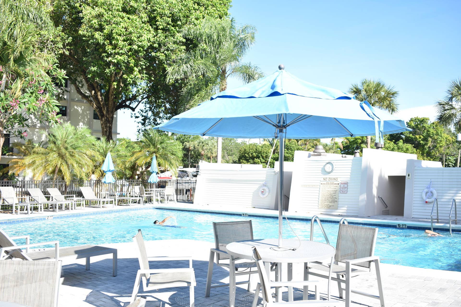 1101 River Reach Drive, #212, Fort Lauderdale, FL 33315 Heated Pool with chairs, loungers and umbrellas