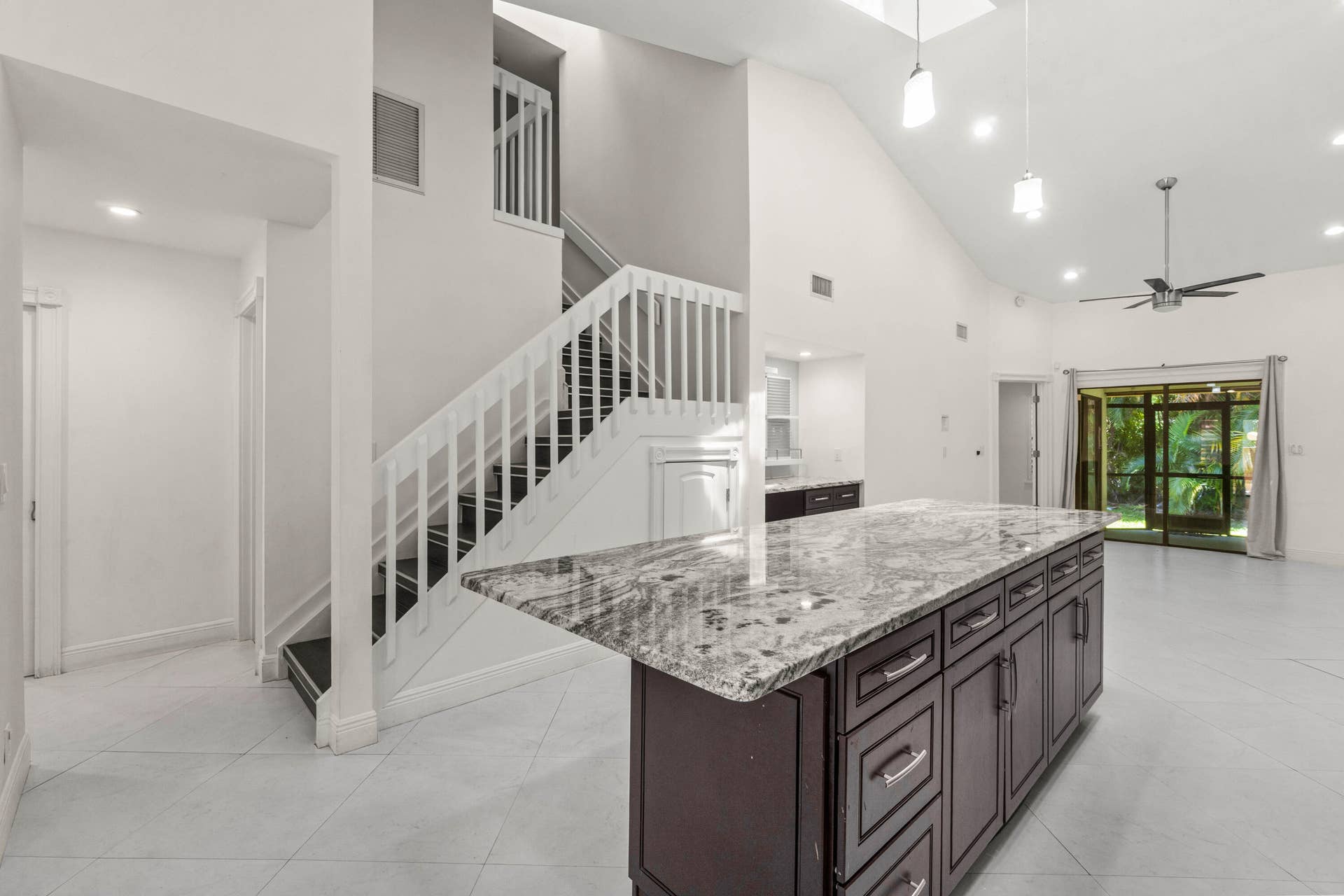 Light and bright Living Area -Skylights in Living Area - Elegant Staircase