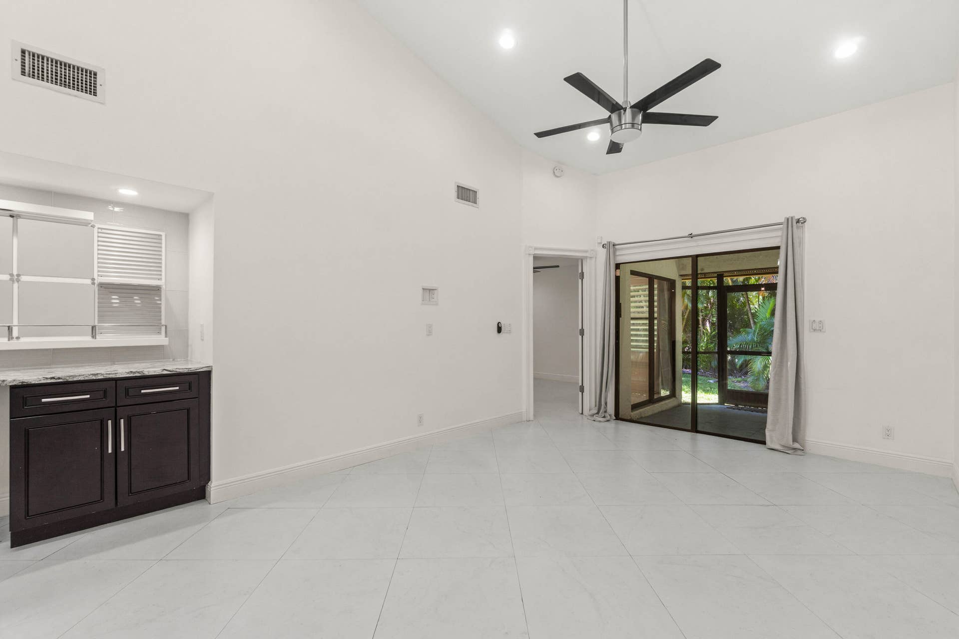 Spacious Living Area with Soaring Vaulted Ceilings and Plenty of Windows and Skylights