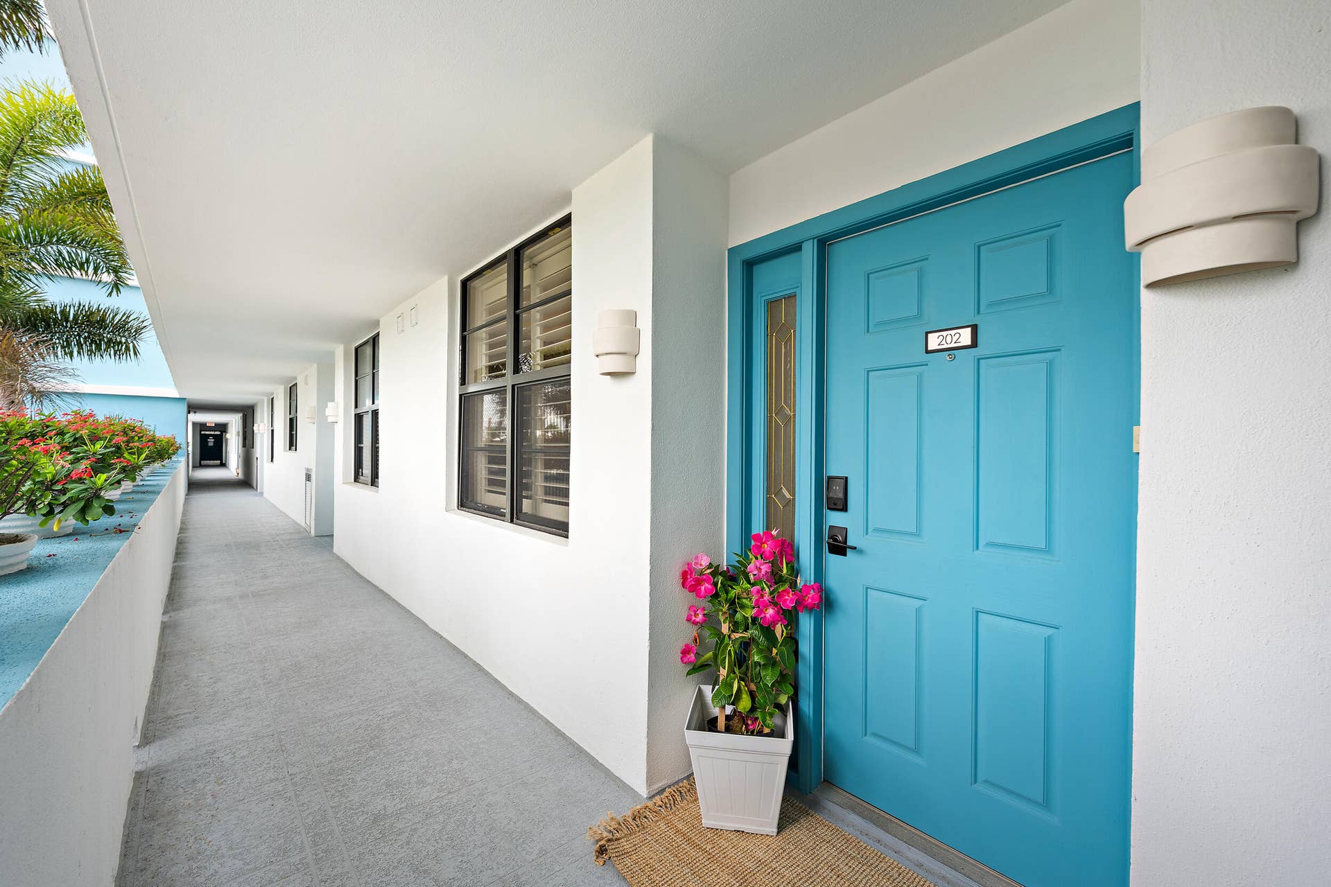 900 Ocean Drive, #202, Juno Beach, FL 33408 Open hallway with elevator and private storage room for unit 202, 1 assigned underground parking