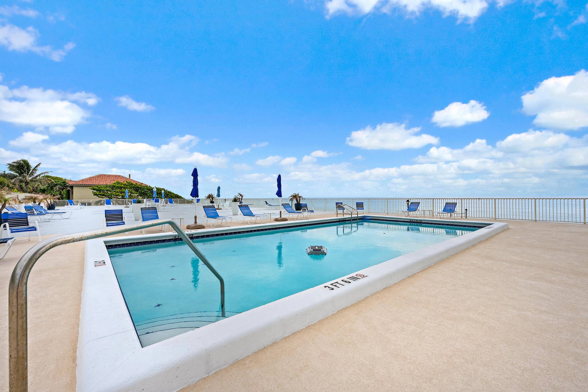 900 Ocean Drive, #202, Juno Beach, FL 33408 Heated Pool overlooking the ocean and additional barbecue area & locked storage for surf/paddle boards