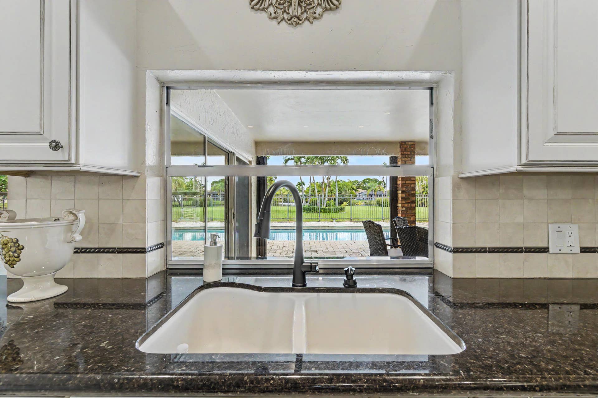 770 Ranch Road, Weston, FL 33326 Large pass through window to covered patio