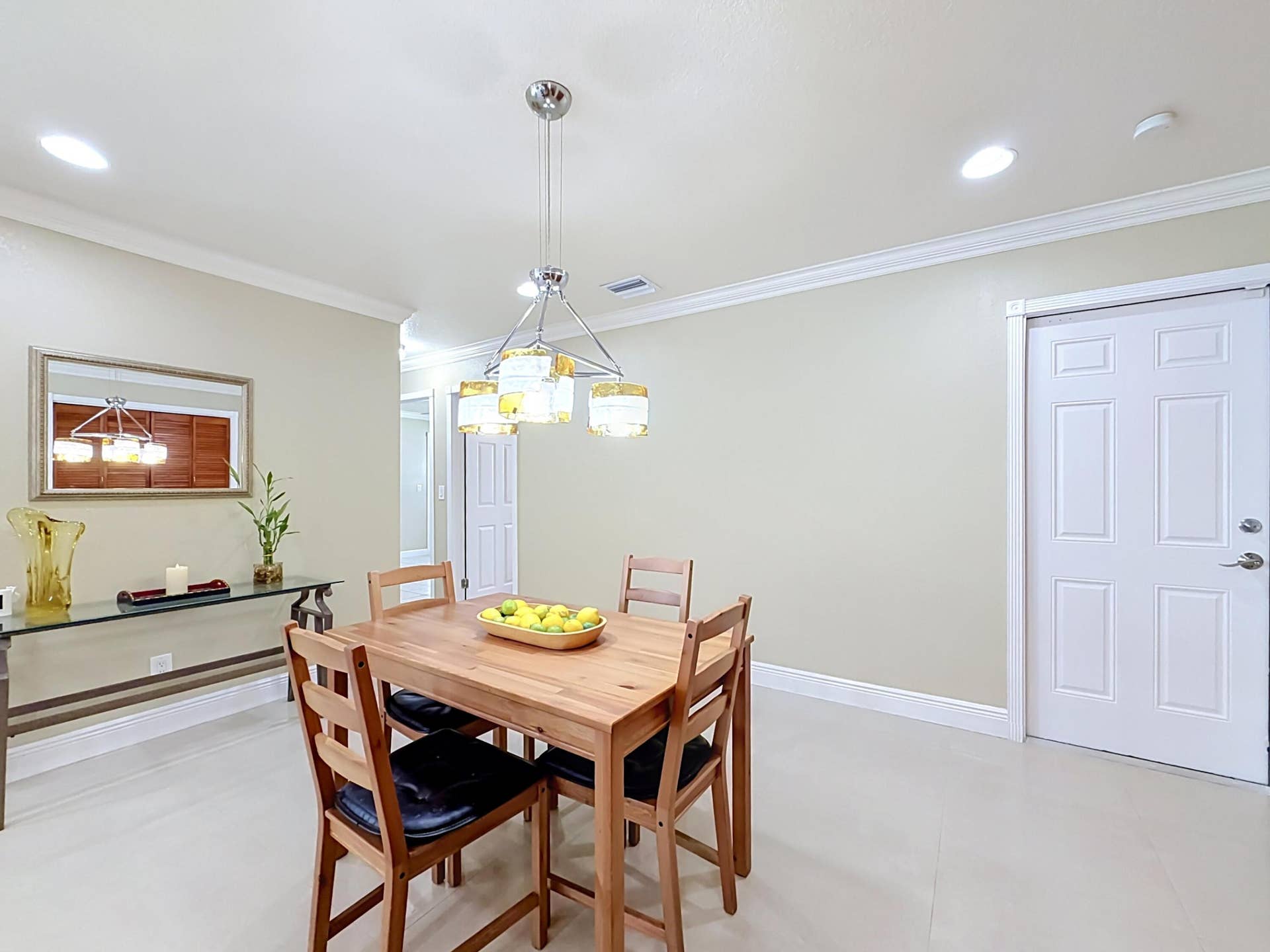 851 E Plantation Circle, Plantation, FL 33324 Casual dining view of garage door and hallway to 3 bedrooms and bathroom