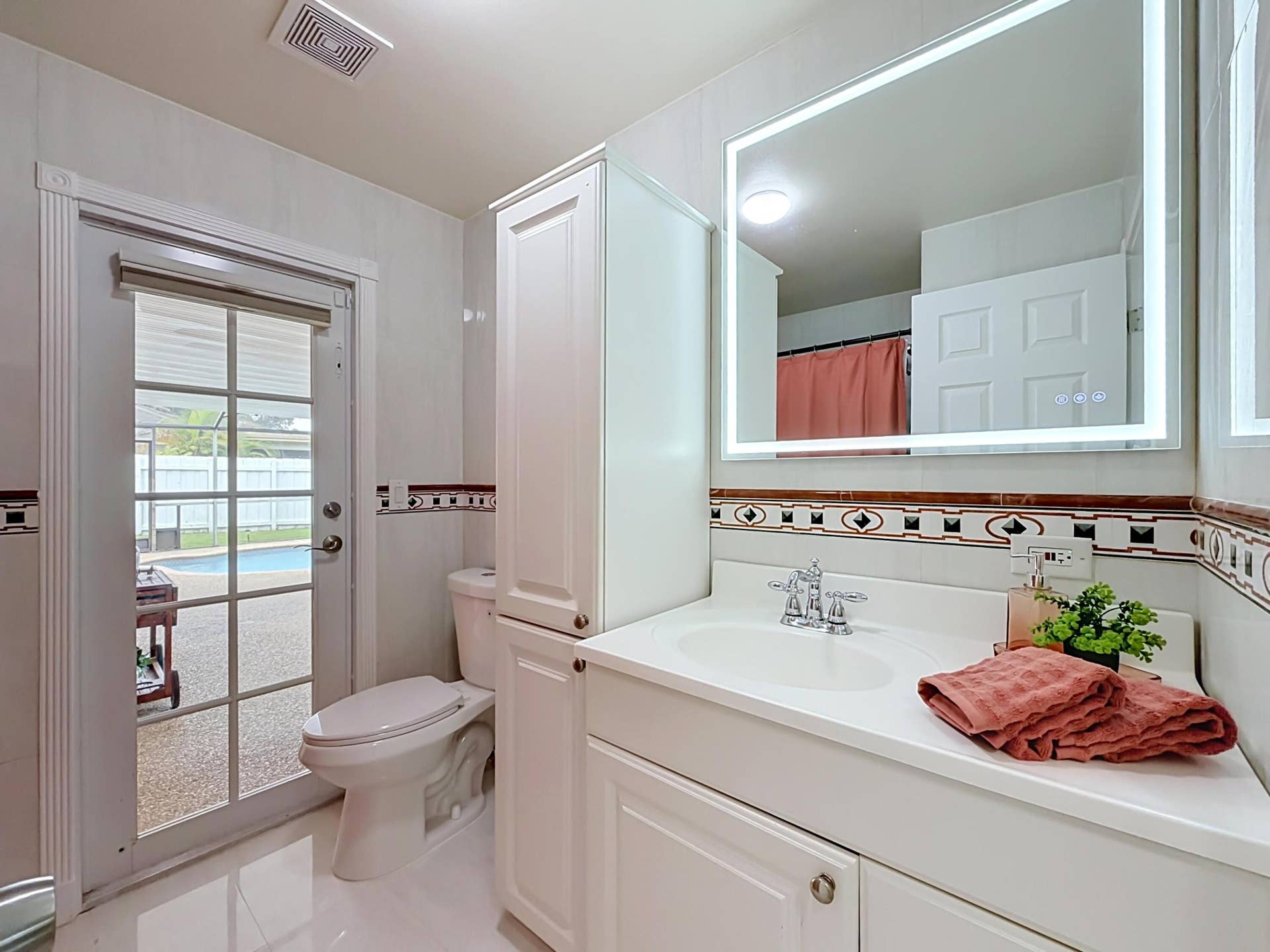 851 E Plantation Circle, Plantation, FL 33324 Bathroom out to pool and new led lighted mirror