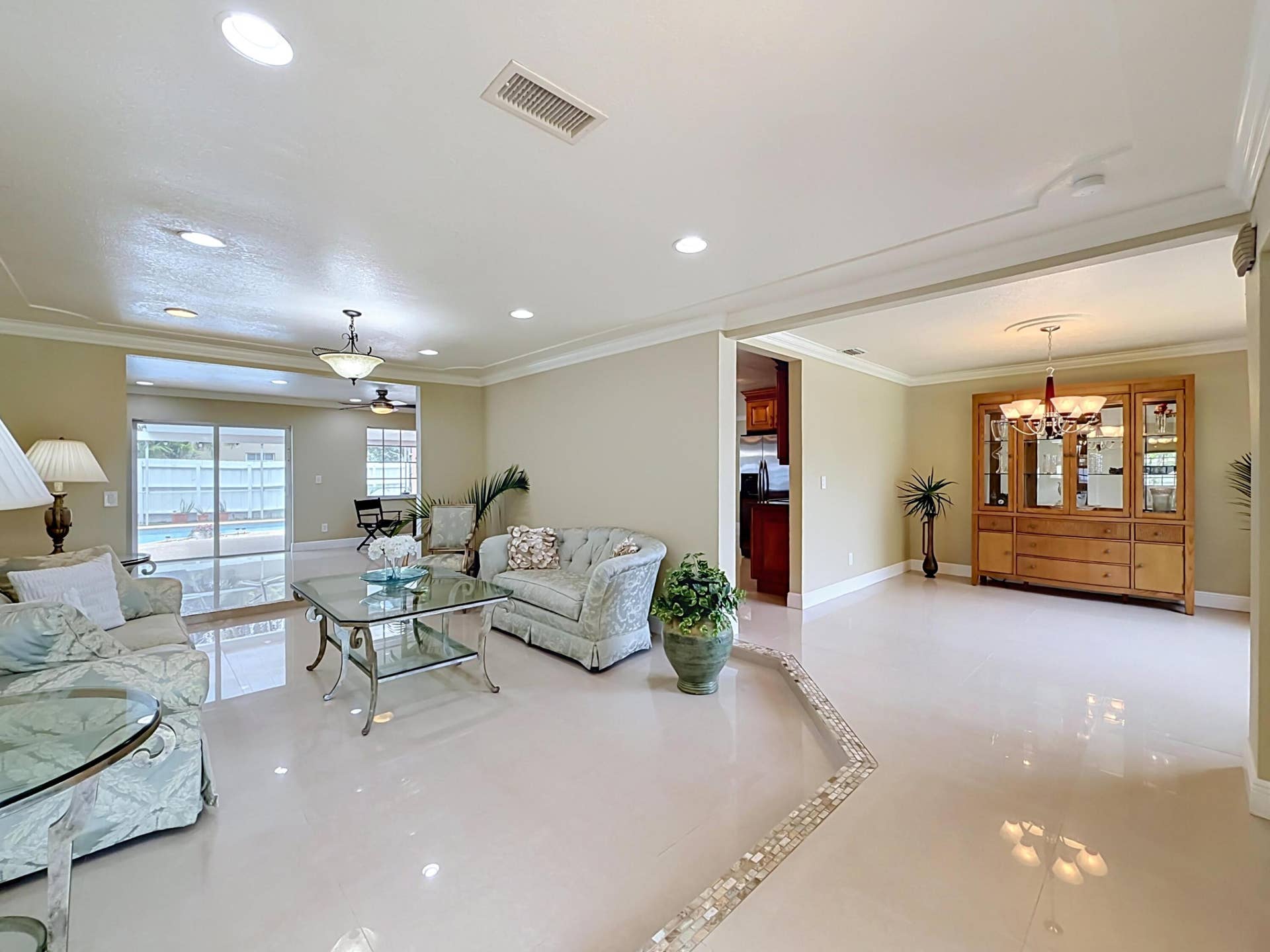 851 E Plantation Circle, Plantation, FL 33324 Enter Living Room to pool or to dining and kitchen
