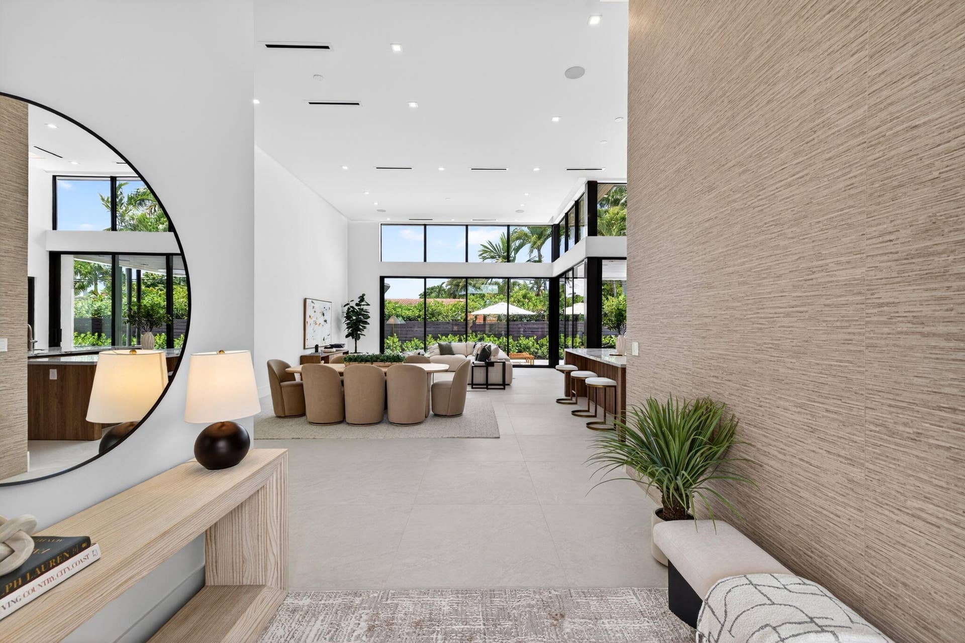 2717 NE 33rd Street, Fort Lauderdale, FL 33306 A polished arrival view showcasing the home's new construction presence, tropical landscaping, and clean Coral Ridge architecture.