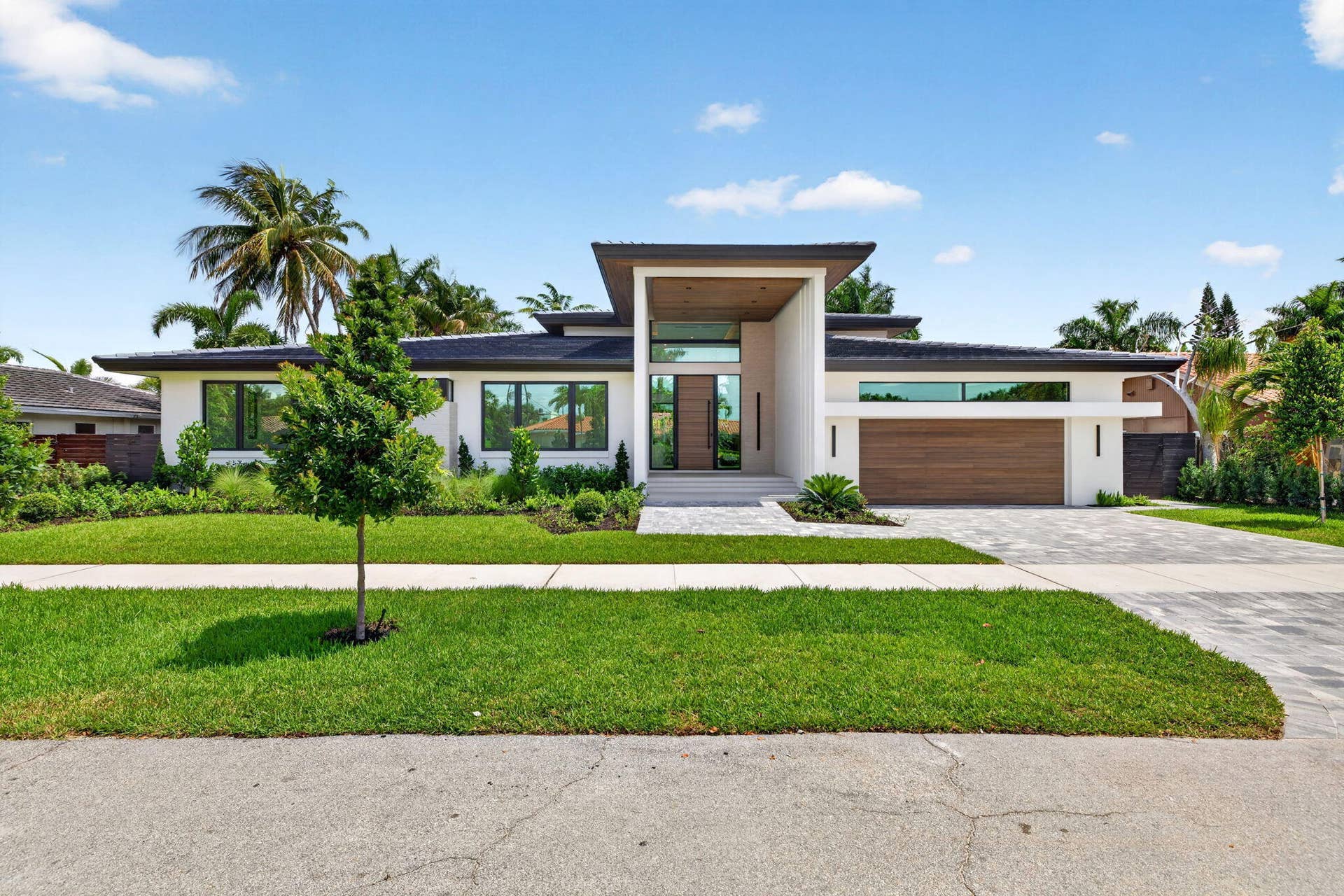 2717 NE 33rd Street, Fort Lauderdale, FL 33306 The front elevation highlights custom architecture, crisp rooflines, and a welcoming approach to this newly completed residence.