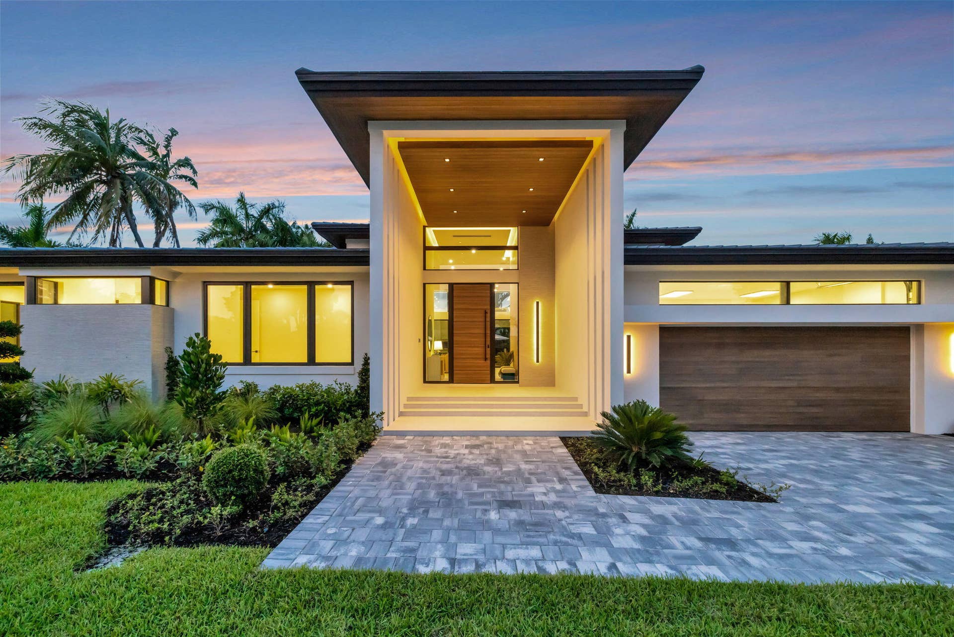 2717 NE 33rd Street, Fort Lauderdale, FL 33306 Modern single-story architecture creates strong curb appeal with a refined entry sequence and manicured Fort Lauderdale setting.