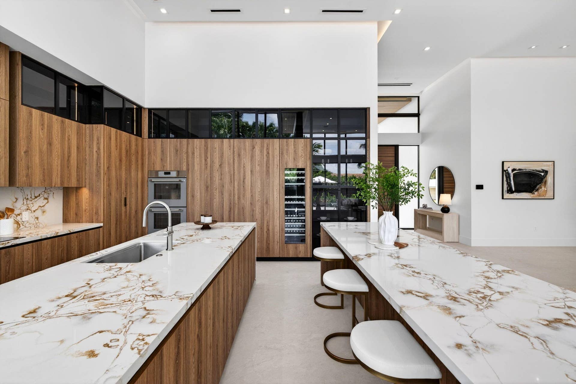 2717 NE 33rd Street, Fort Lauderdale, FL 33306 The double-island kitchen anchors the home with Italian custom cabinetry, Thermador appliances, and sophisticated entertaining space.