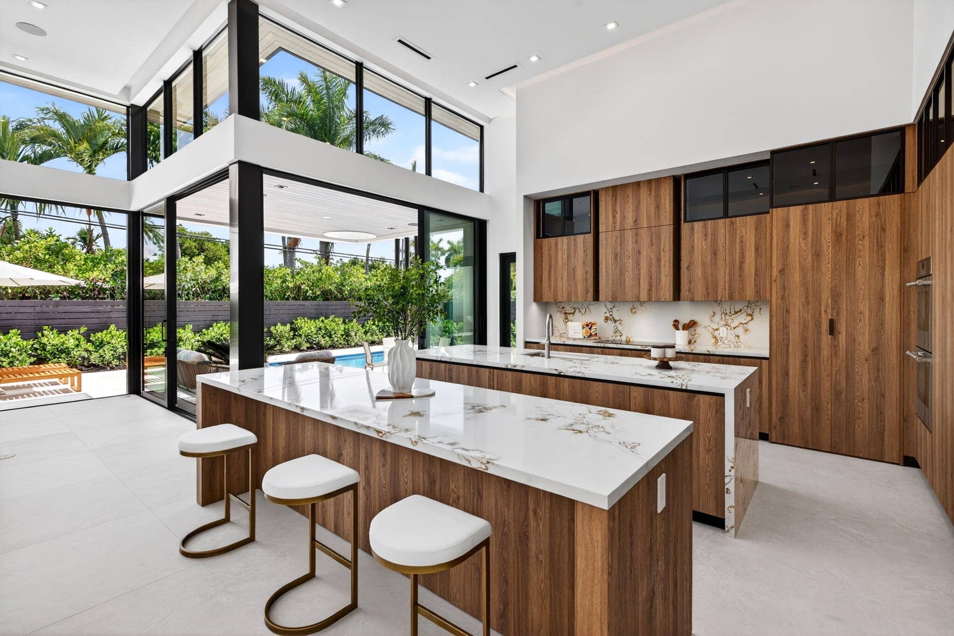 2717 NE 33rd Street, Fort Lauderdale, FL 33306 Light-filled interiors emphasize dramatic volume, clean modern finishes, and a seamless connection between living and entertaining spaces.