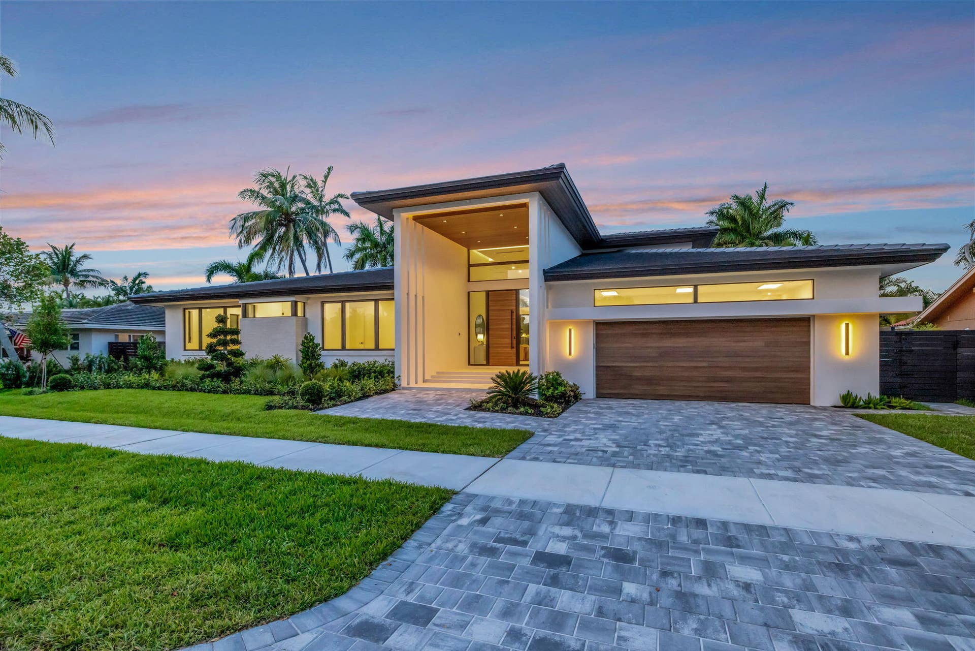 2717 NE 33rd Street, Fort Lauderdale, FL 33306 Modern single-story architecture creates strong curb appeal with a refined entry sequence and manicured Fort Lauderdale setting.