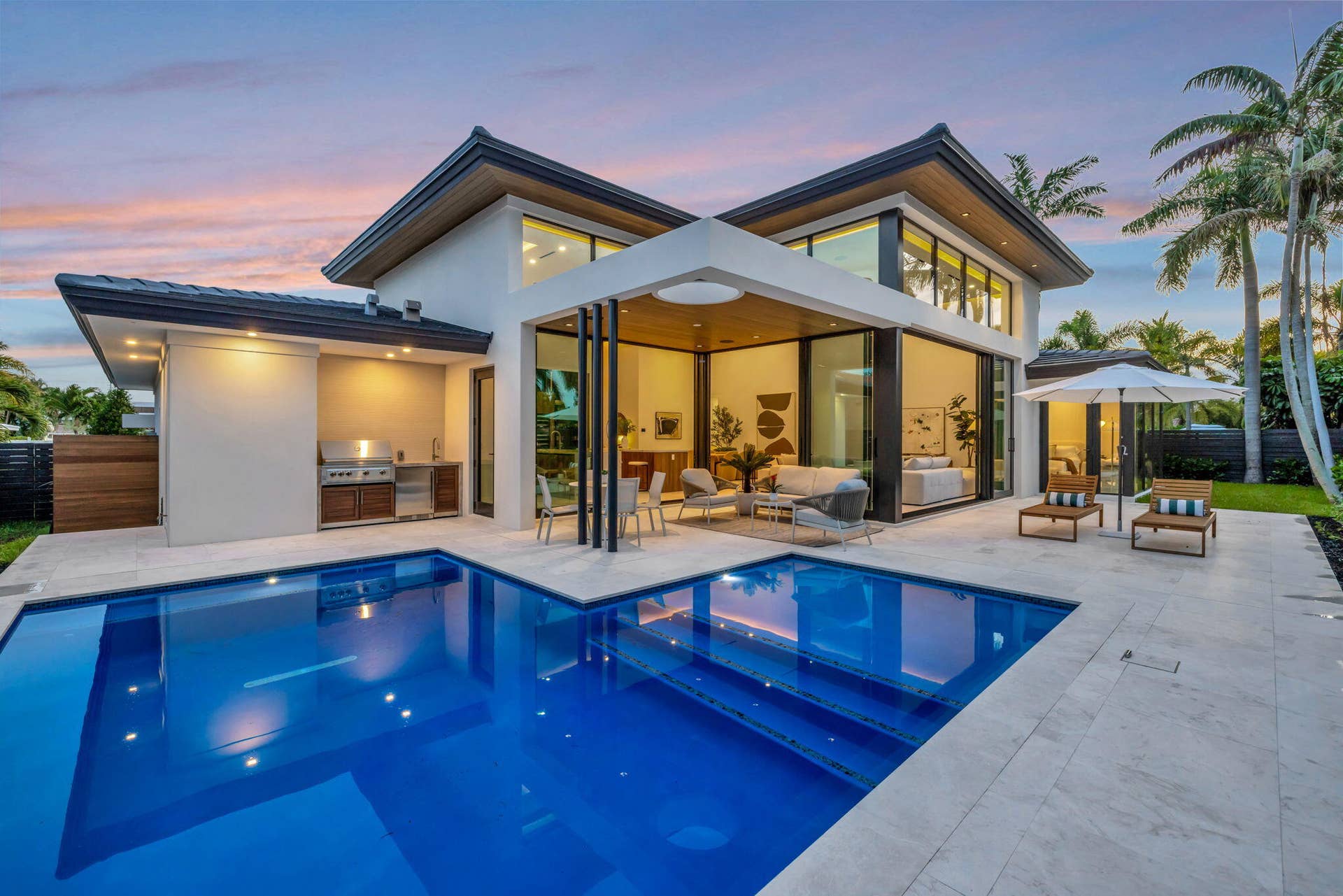 2717 NE 33rd Street, Fort Lauderdale, FL 33306 A resort-style patio setting connects the interiors to the pool, landscaping, and year-round open-air living.