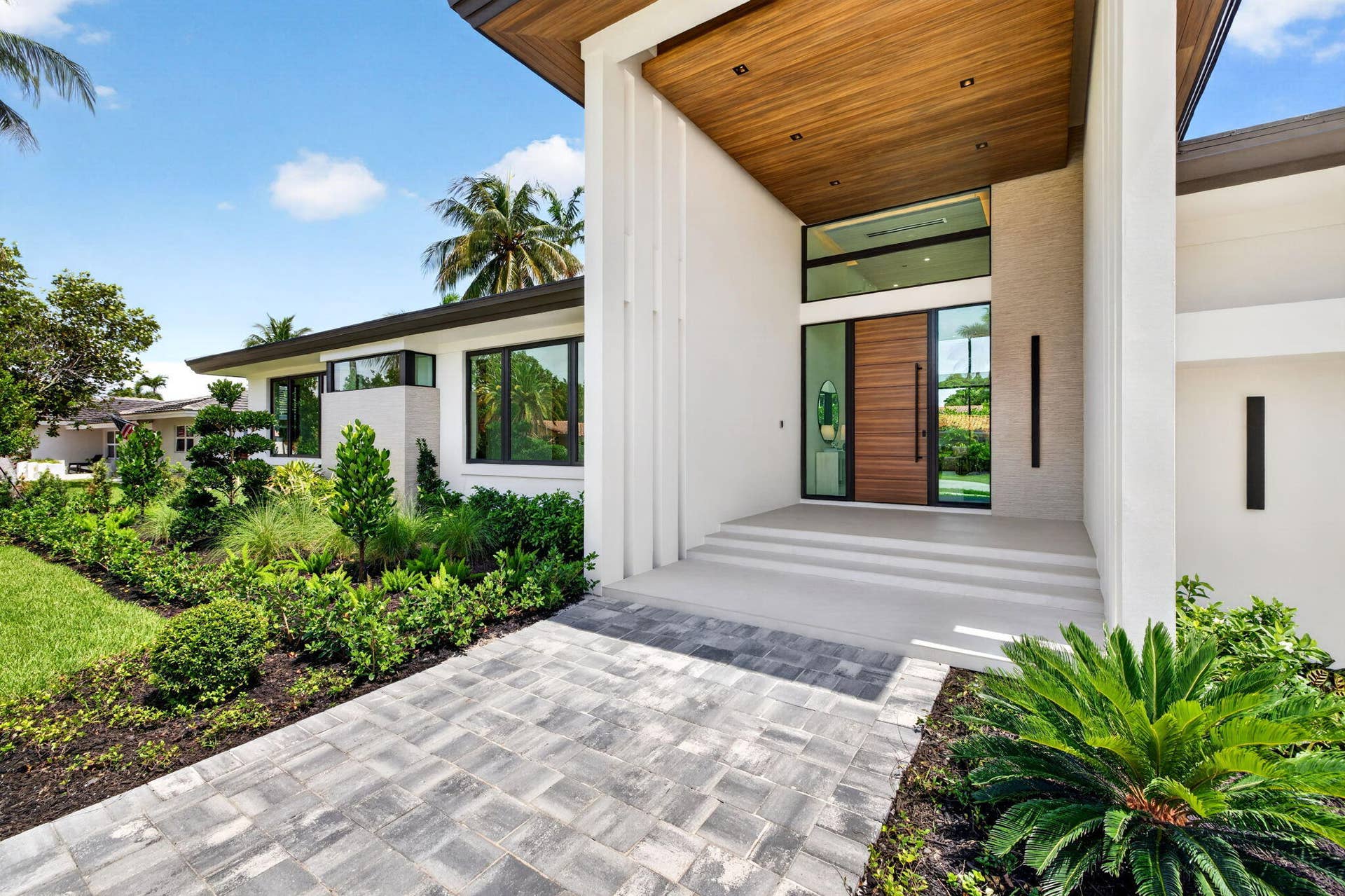 2717 NE 33rd Street, Fort Lauderdale, FL 33306 The front elevation highlights custom architecture, crisp rooflines, and a welcoming approach to this newly completed residence.
