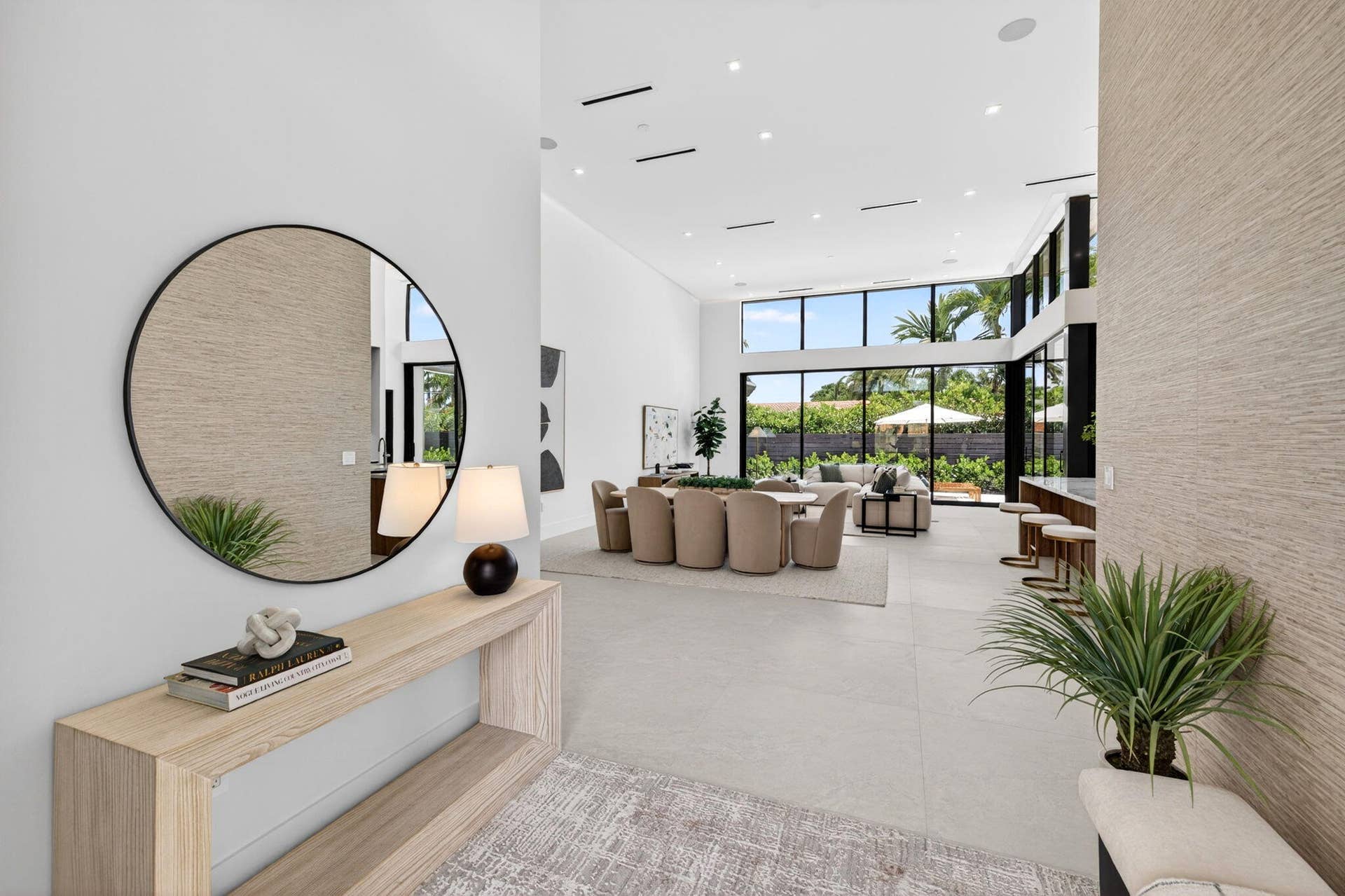 2717 NE 33rd Street, Fort Lauderdale, FL 33306 An open interior perspective captures the home's airy scale, refined material palette, and effortless single-story living.