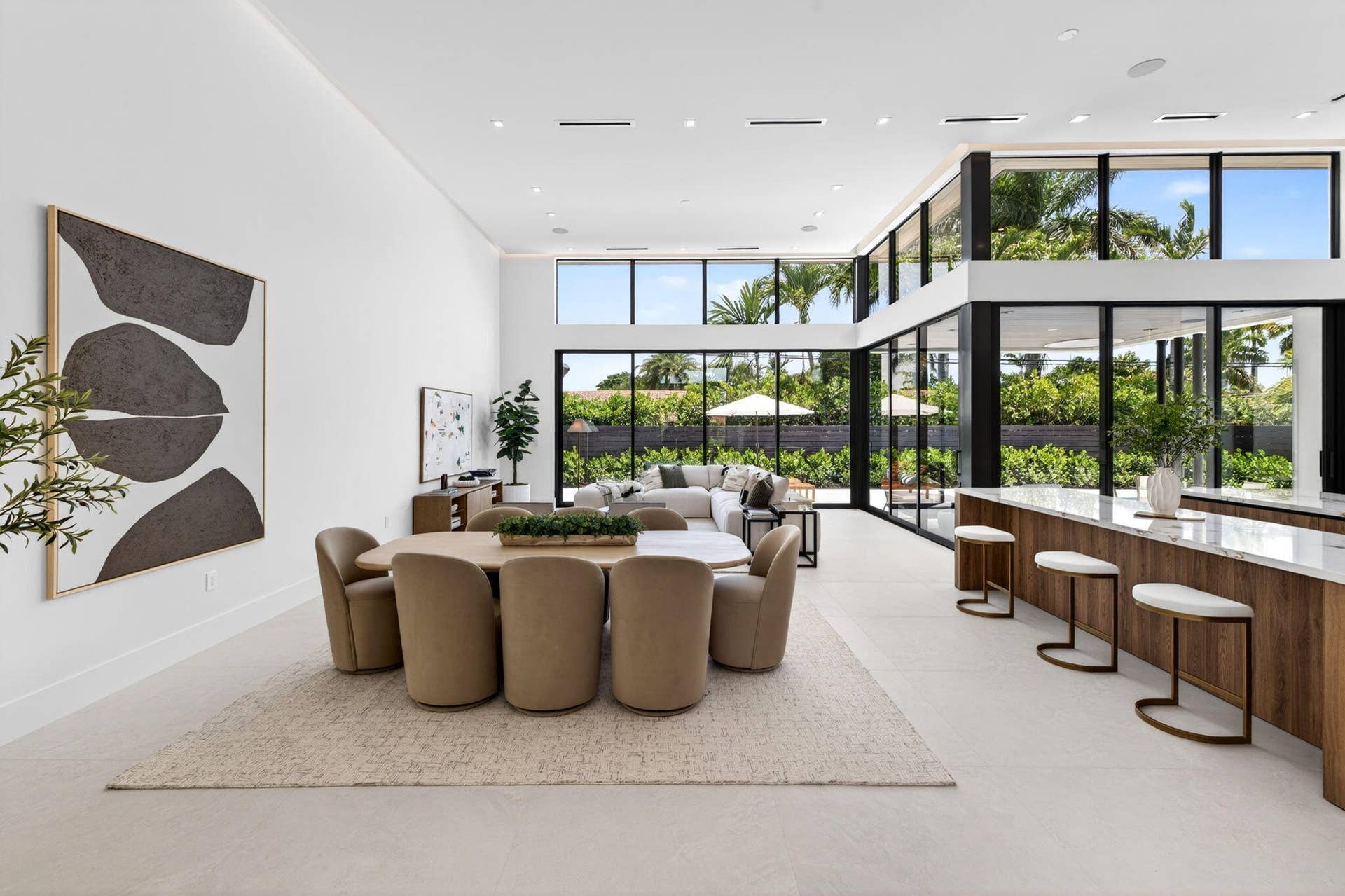 2717 NE 33rd Street, Fort Lauderdale, FL 33306 An open interior perspective captures the home's airy scale, refined material palette, and effortless single-story living.