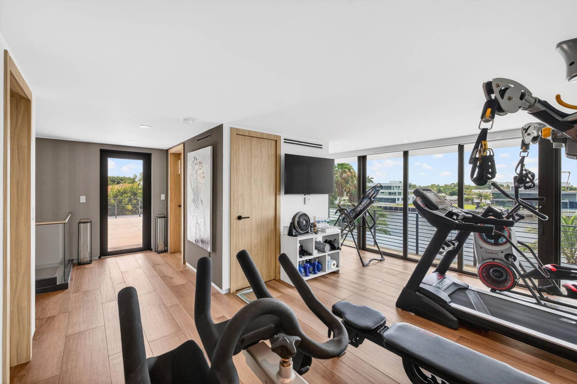 A private fitness destination positioned to enjoy elevated river views, bringing wellness and luxury together within the home.