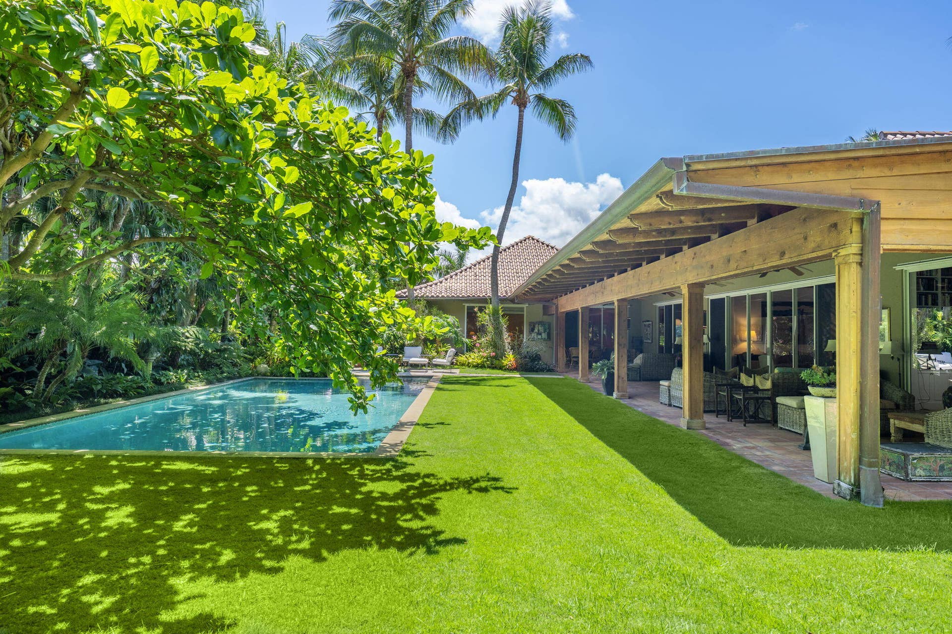 6 La Costa Way, Palm Beach, FL 33480 Pool and gardens surrounding house on a .78 acre lot