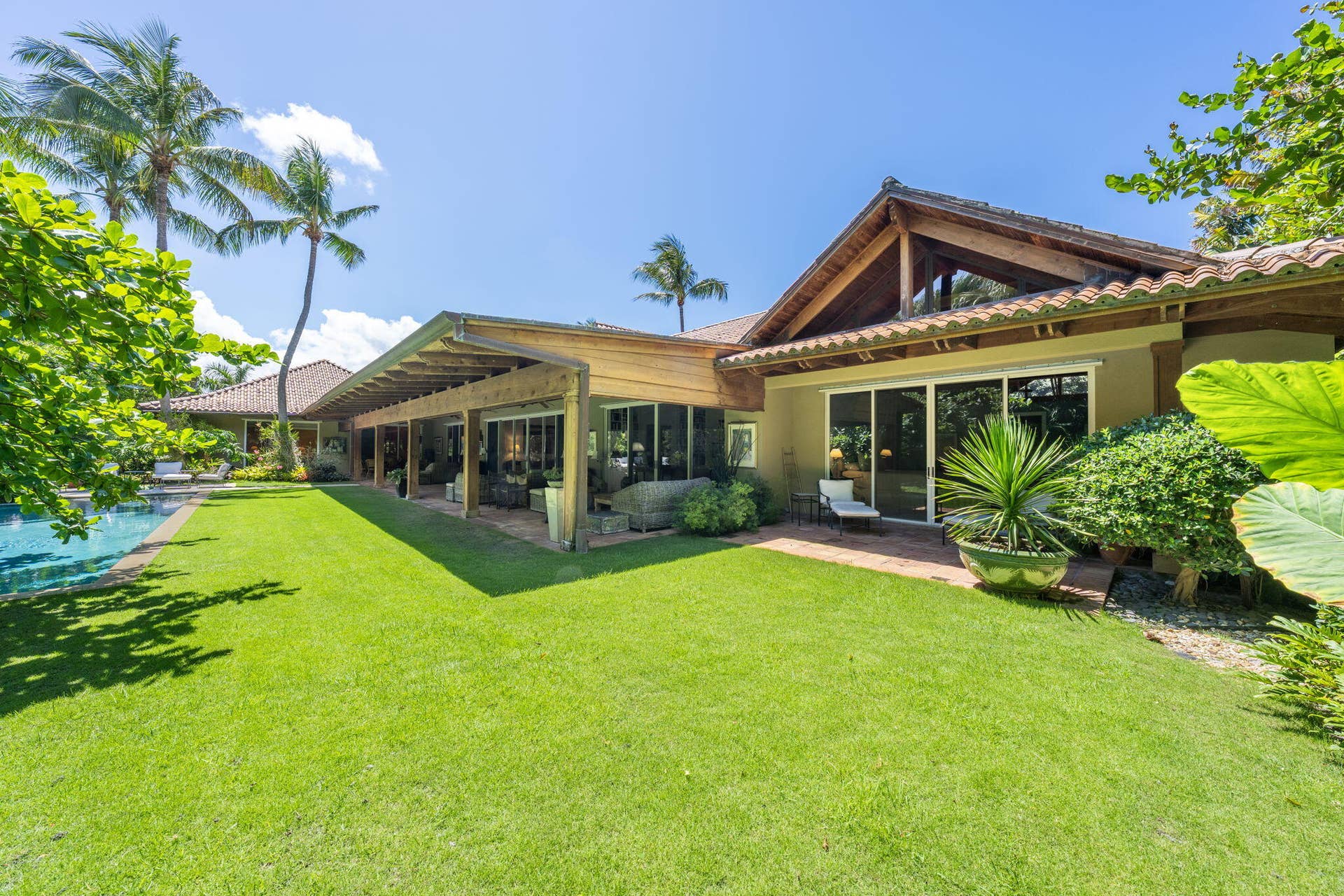 6 La Costa Way, Palm Beach, FL 33480 Pool and gardens surrounding home on a .78 acre lot.