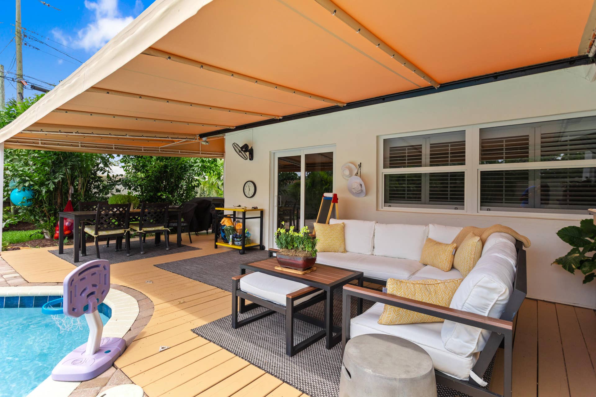 1420 NE 42nd Court, Oakland Park, FL 33334 Covered Patio lounging and dining