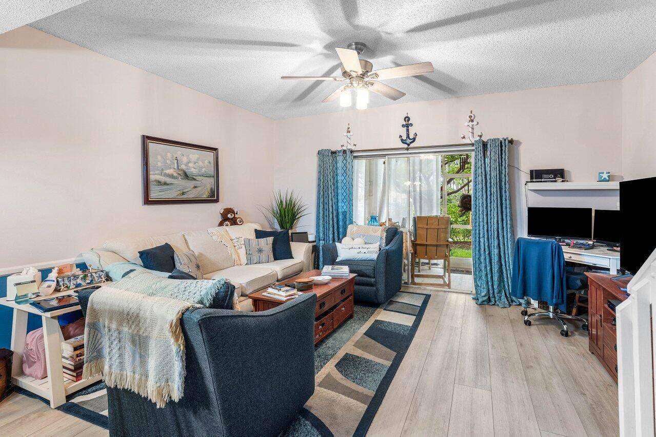 1022 Kokomo Key Lane, Delray Beach, FL 33483 Living with sliding door to screen porch