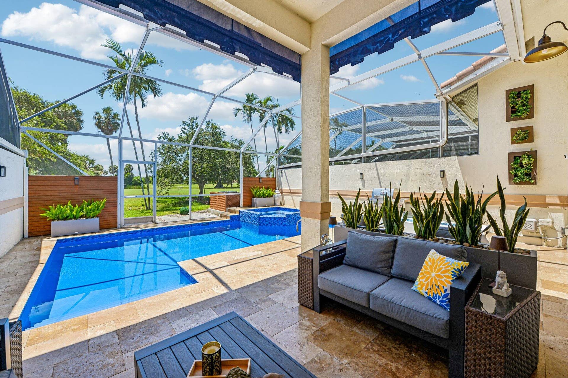 692 W Palm Aire Drive, Pompano Beach, FL 33069 The Low Maintenance Entertainers Screened In Yard! Heated Pool and Spa With Gold Course Views