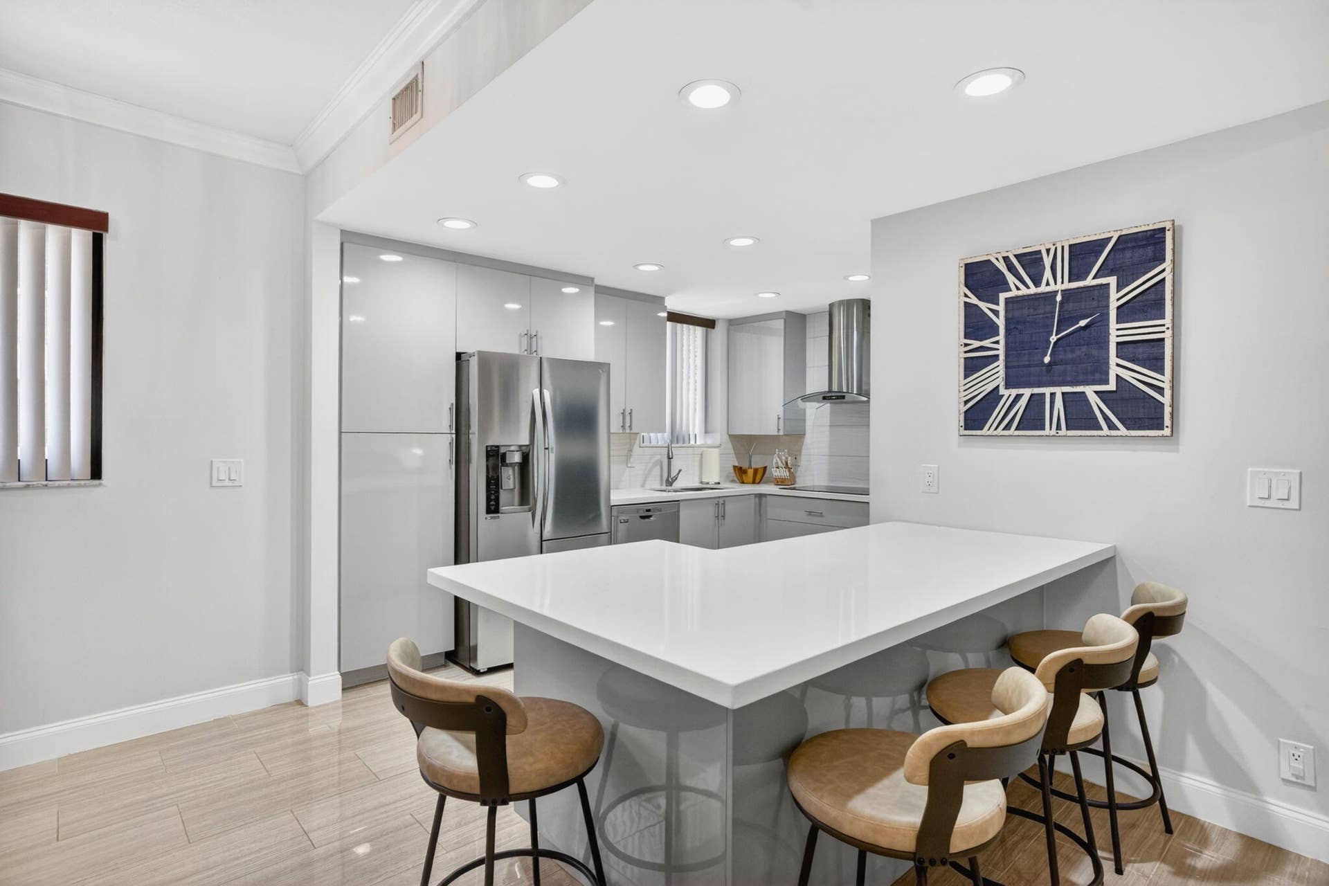 Kitchen features an oversized island with seatingperfect for entertaining or casual dining