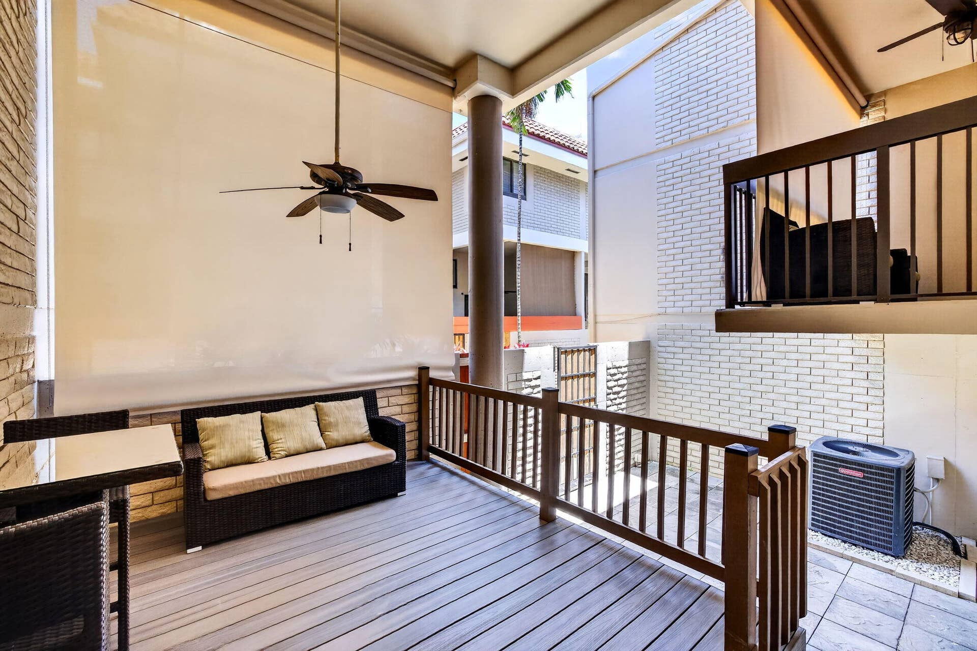 Elevated deck area with access to patio and garage