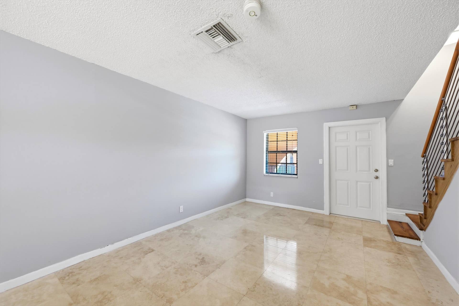 905 NE 28th Street, #206, Wilton Manors, FL 33334 Living room featuring beautiful flooring and an inviting open layout.