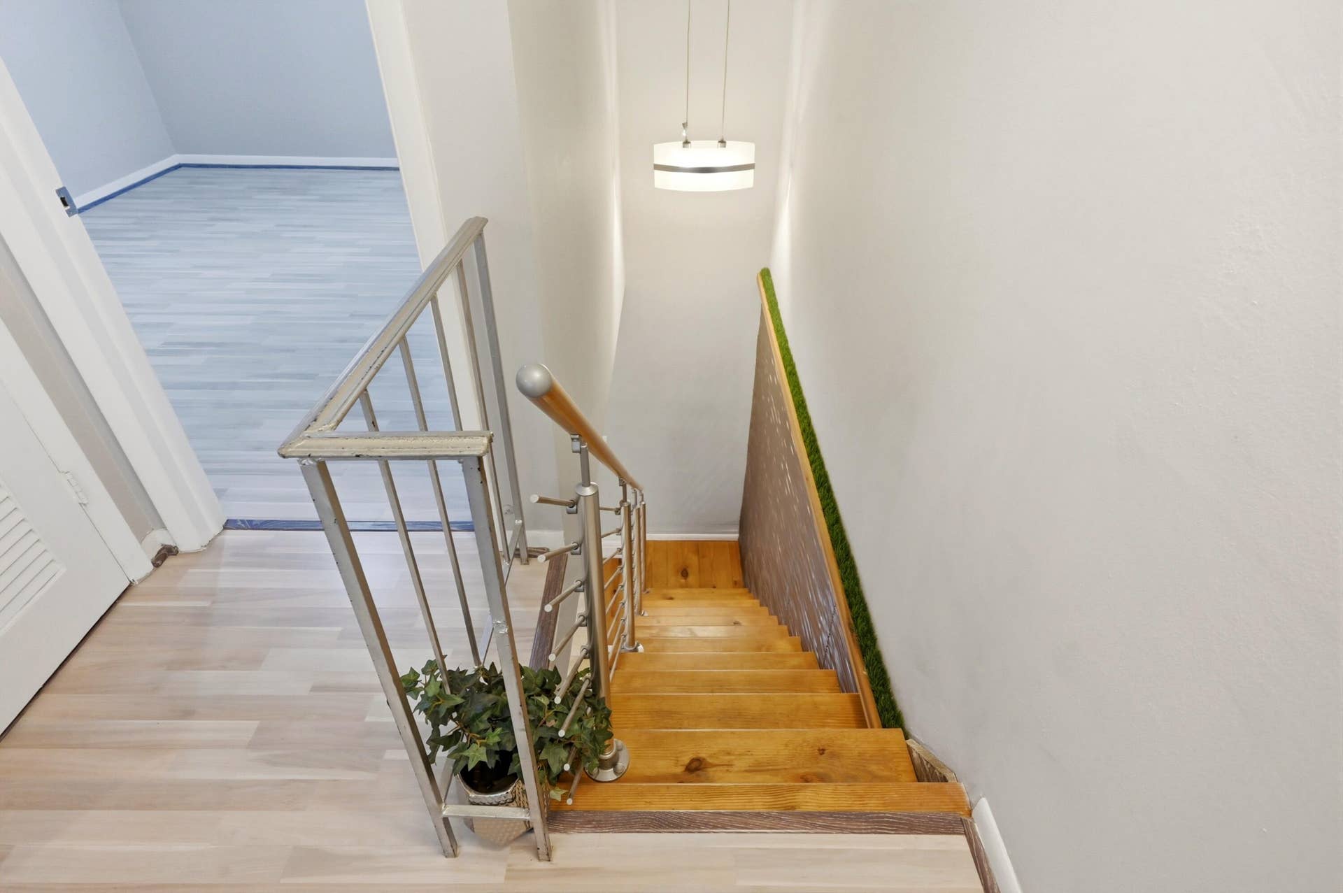 905 NE 28th Street, #206, Wilton Manors, FL 33334 Staircase leading to the bedrooms and full bathroom, creating a well designed separation of living and private spaces.