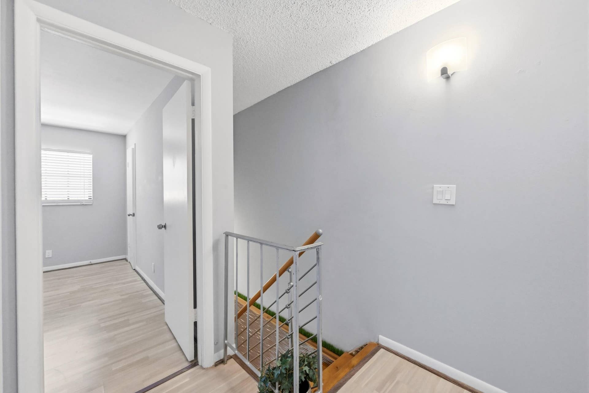 905 NE 28th Street, #206, Wilton Manors, FL 33334 Staircase connecting the main living area to the bedrooms and full bathroom, offering added privacy and a true townhome feel.