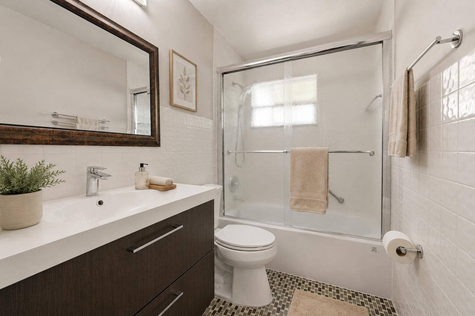 905 NE 28th Street, #206, Wilton Manors, FL 33334 Virtually staged full bathroom with tub featuring a clean, functional design.