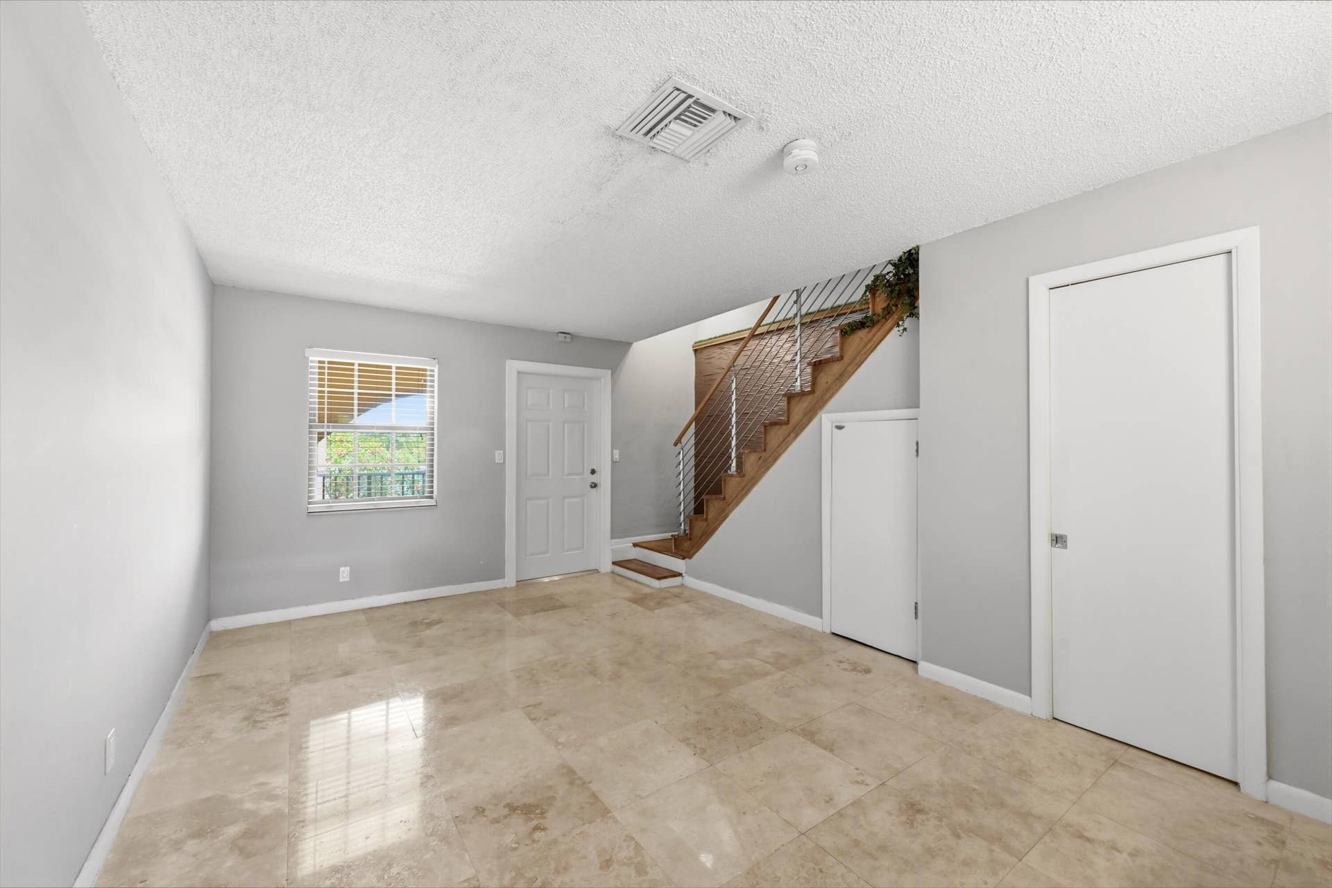 905 NE 28th Street, #206, Wilton Manors, FL 33334 Spacious living room featuring beautiful flooring and an open, inviting atmosphere.