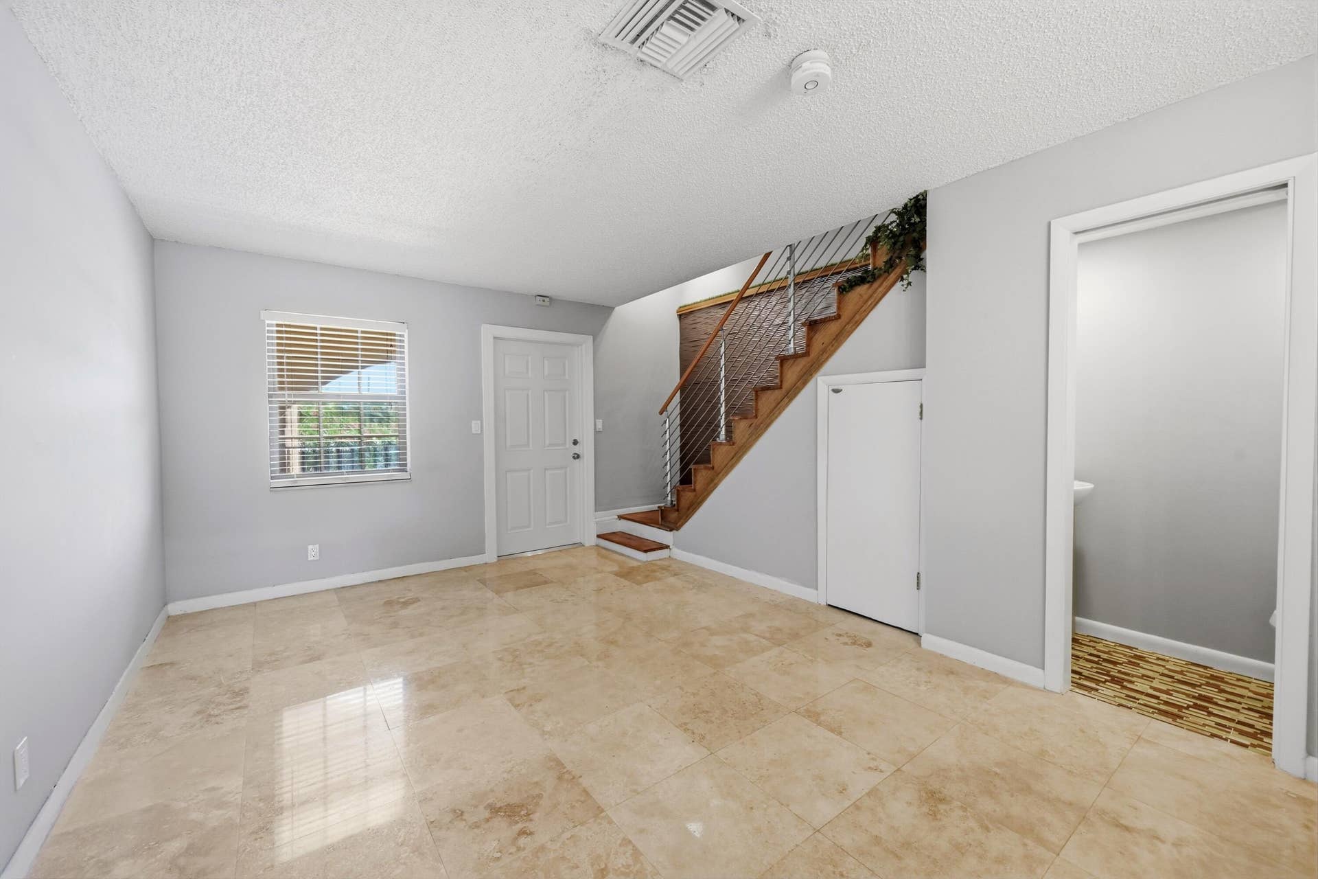 905 NE 28th Street, #206, Wilton Manors, FL 33334 Open living area highlighted by beautiful flooring and a comfortable design.