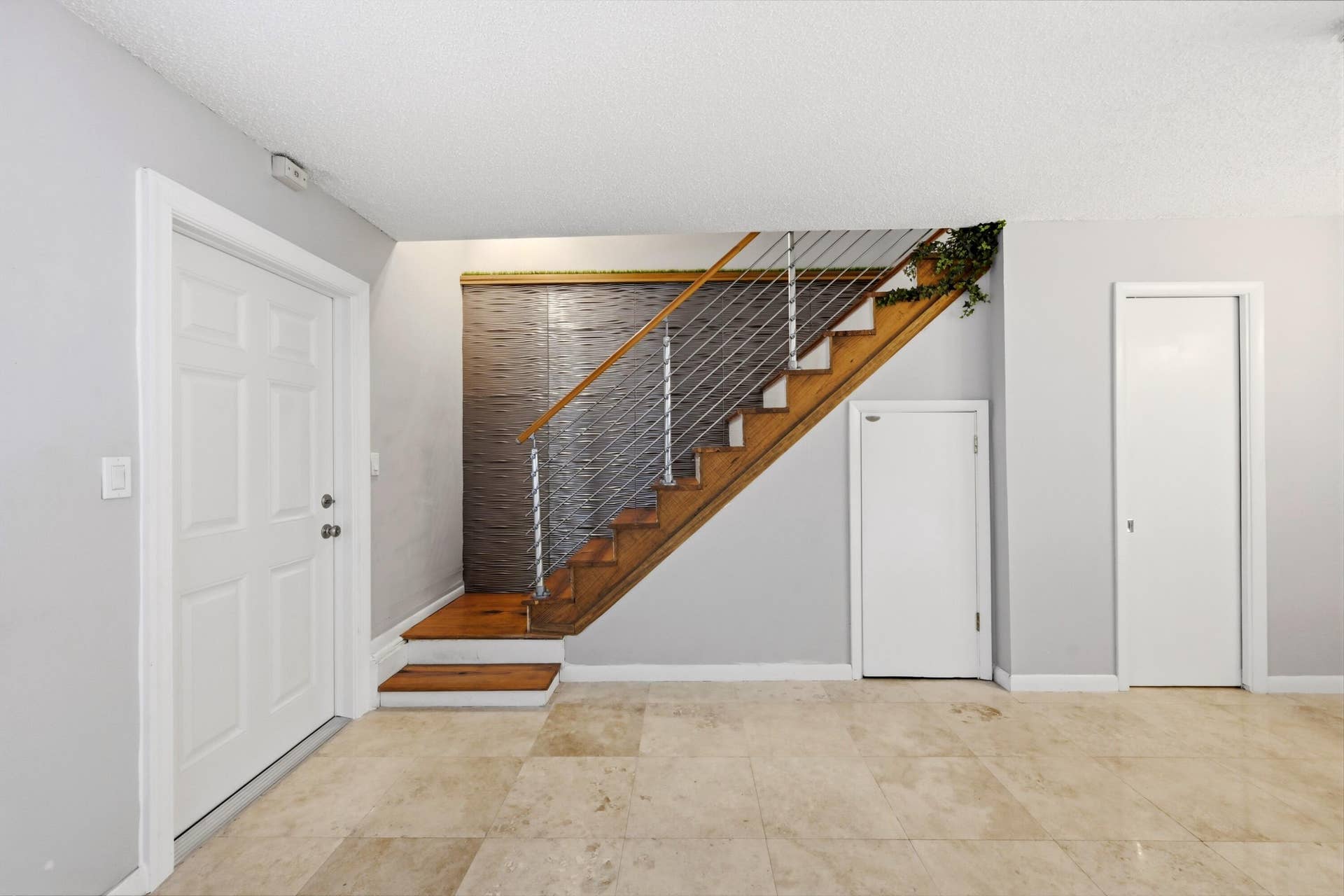 905 NE 28th Street, #206, Wilton Manors, FL 33334 Living room showcasing beautiful flooring and a bright, comfortable living space.