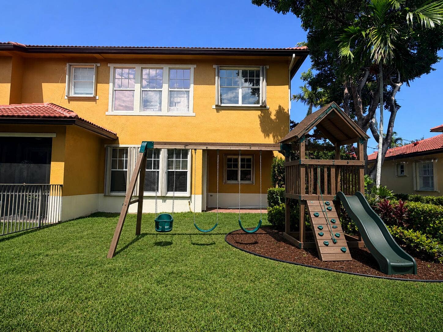 5772 NW 119th Drive, Coral Springs, Coral Springs, FL 33076 Swing set virtually staged