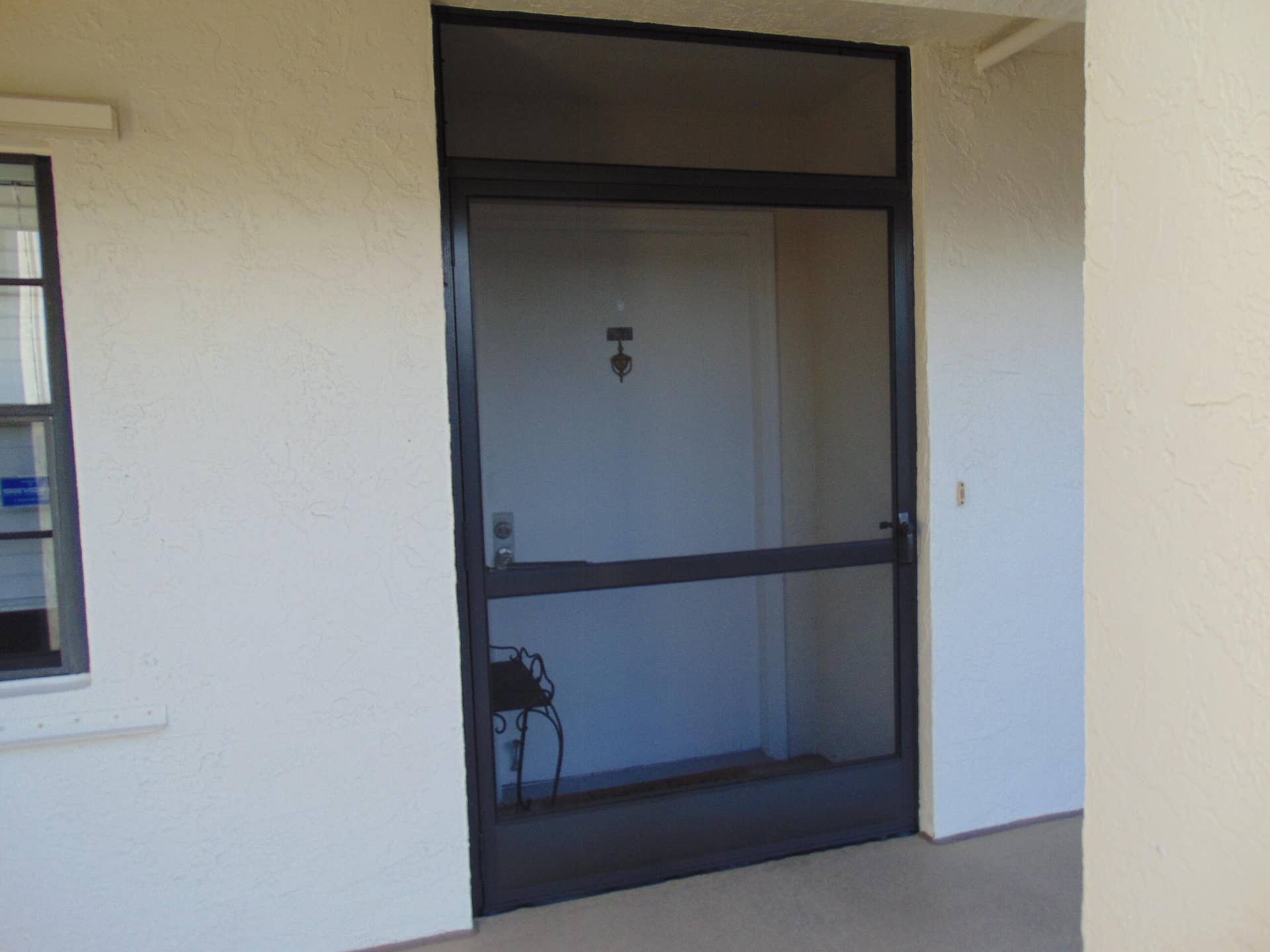 9220 SW 14th Street, #3103, Boca Raton, FL 33428 WIDE FRONT DOOR WITH SCREEN DOOR LEADS TO ENTRY FOYER