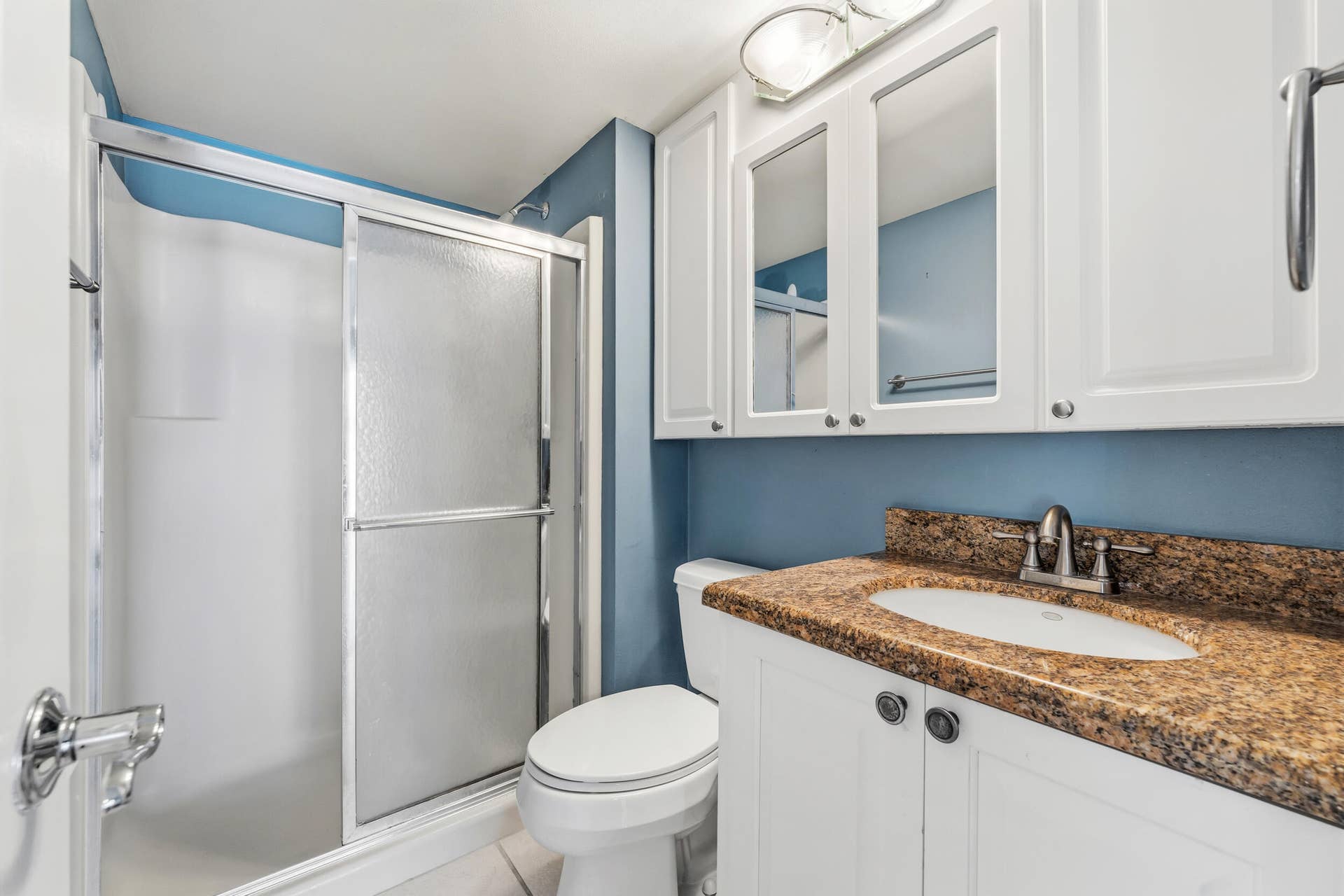 6314 Chasewood Drive, #E, Jupiter, FL 33458 Primary bathroom with comfort height toilet and vanity