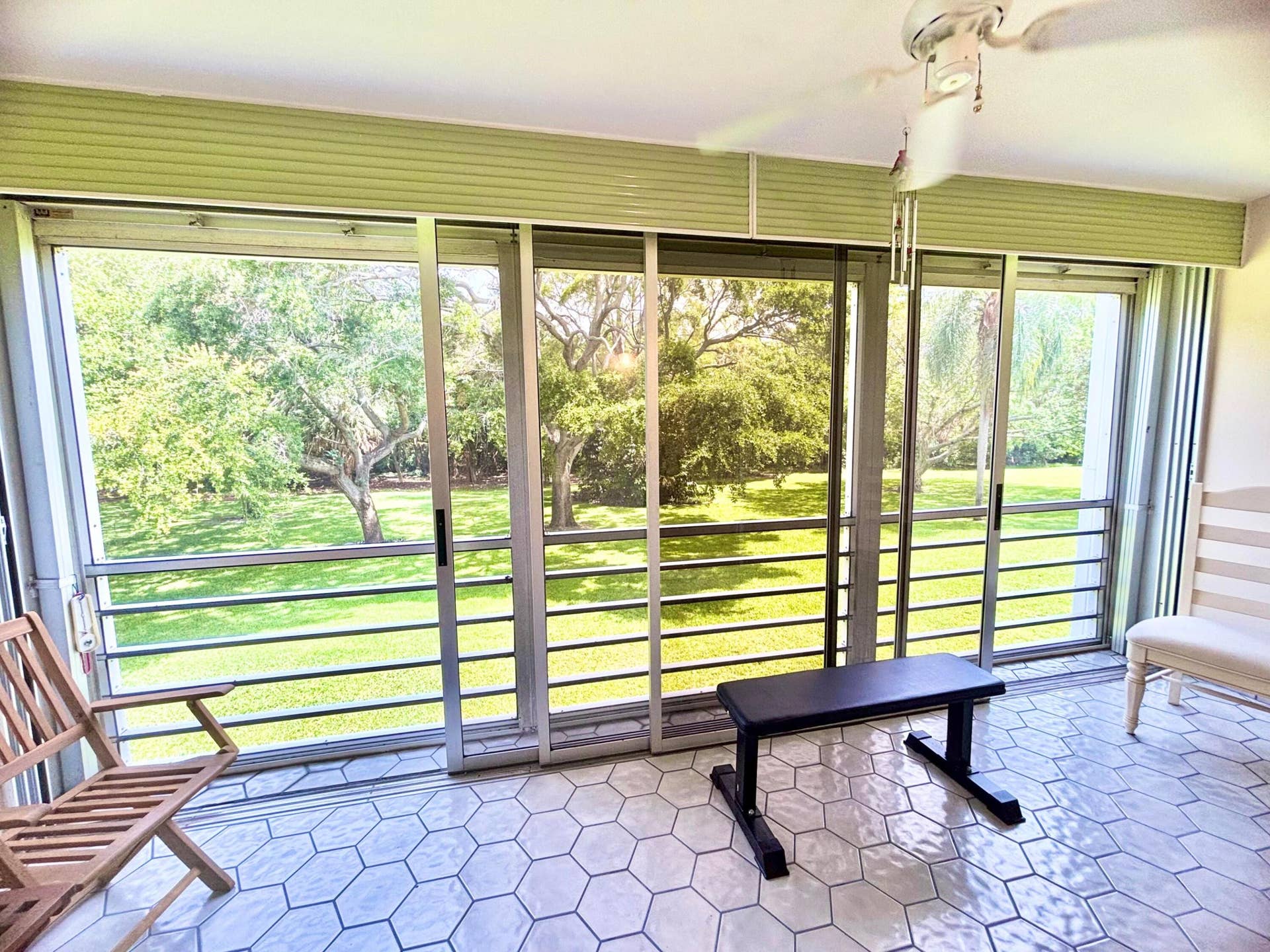 Patio area features ceramic tile, floor to ceiling sliding doors